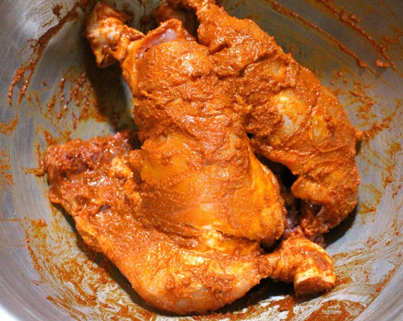 step 3 Thoroughly rub the Tandoori Paste (1/2 cup) into the chicken. Place in a bowl, cover, and refrigerate overnight.