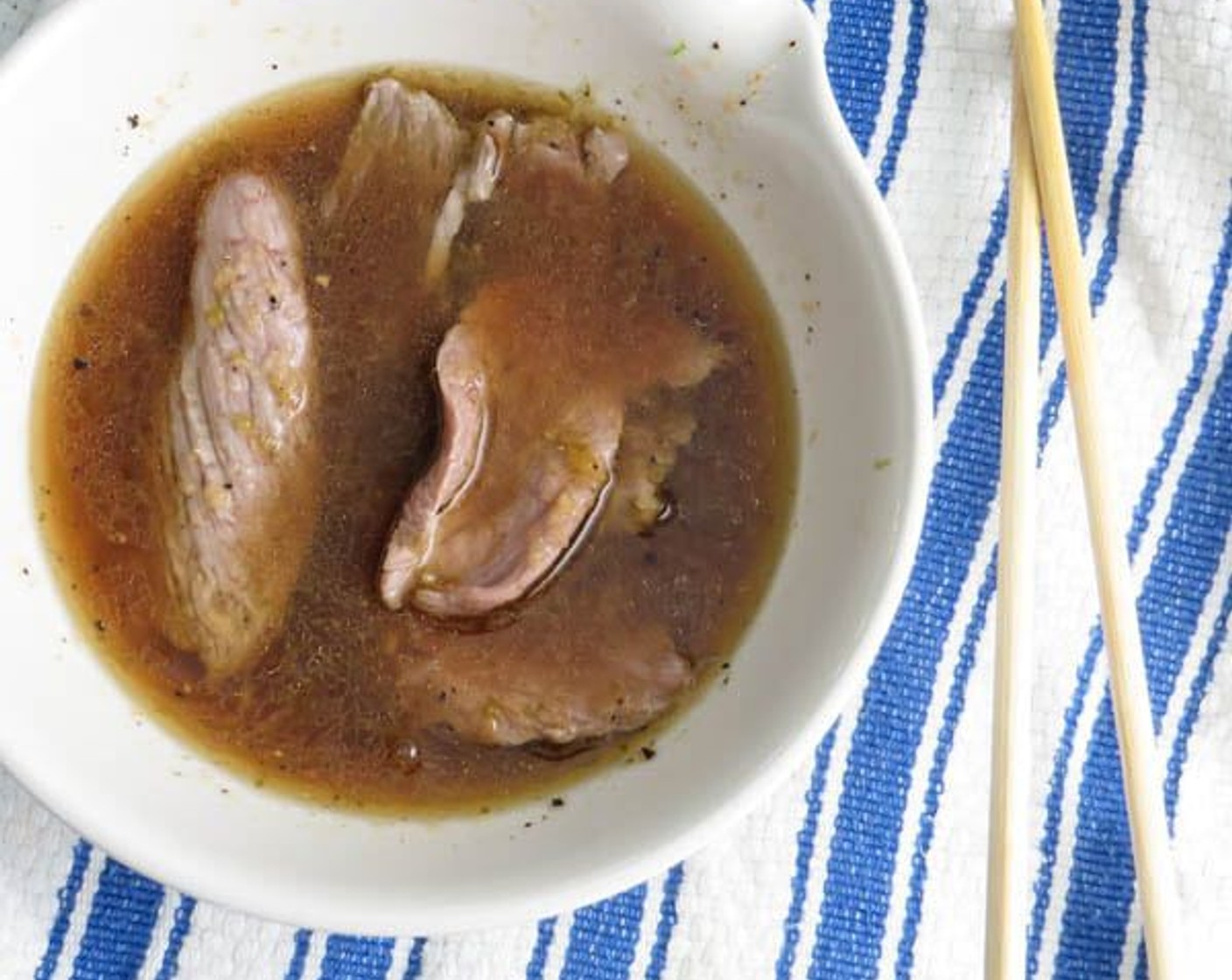 step 8 Retrieve the beef and place in cold vinaigrette. Repeat with remaining beef slices.