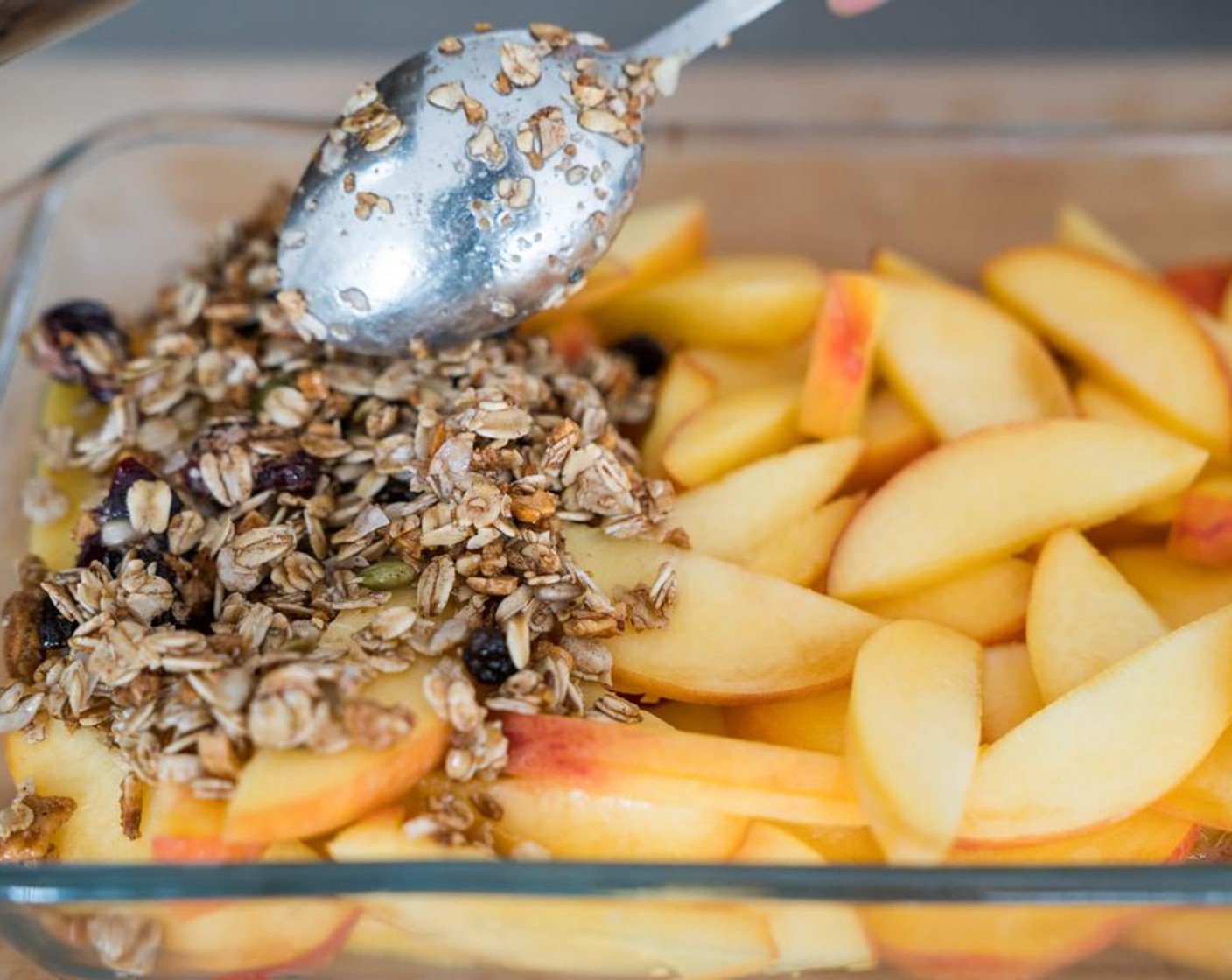 step 4 Top peaches with crisp and pop in the oven for 25-30 minutes.