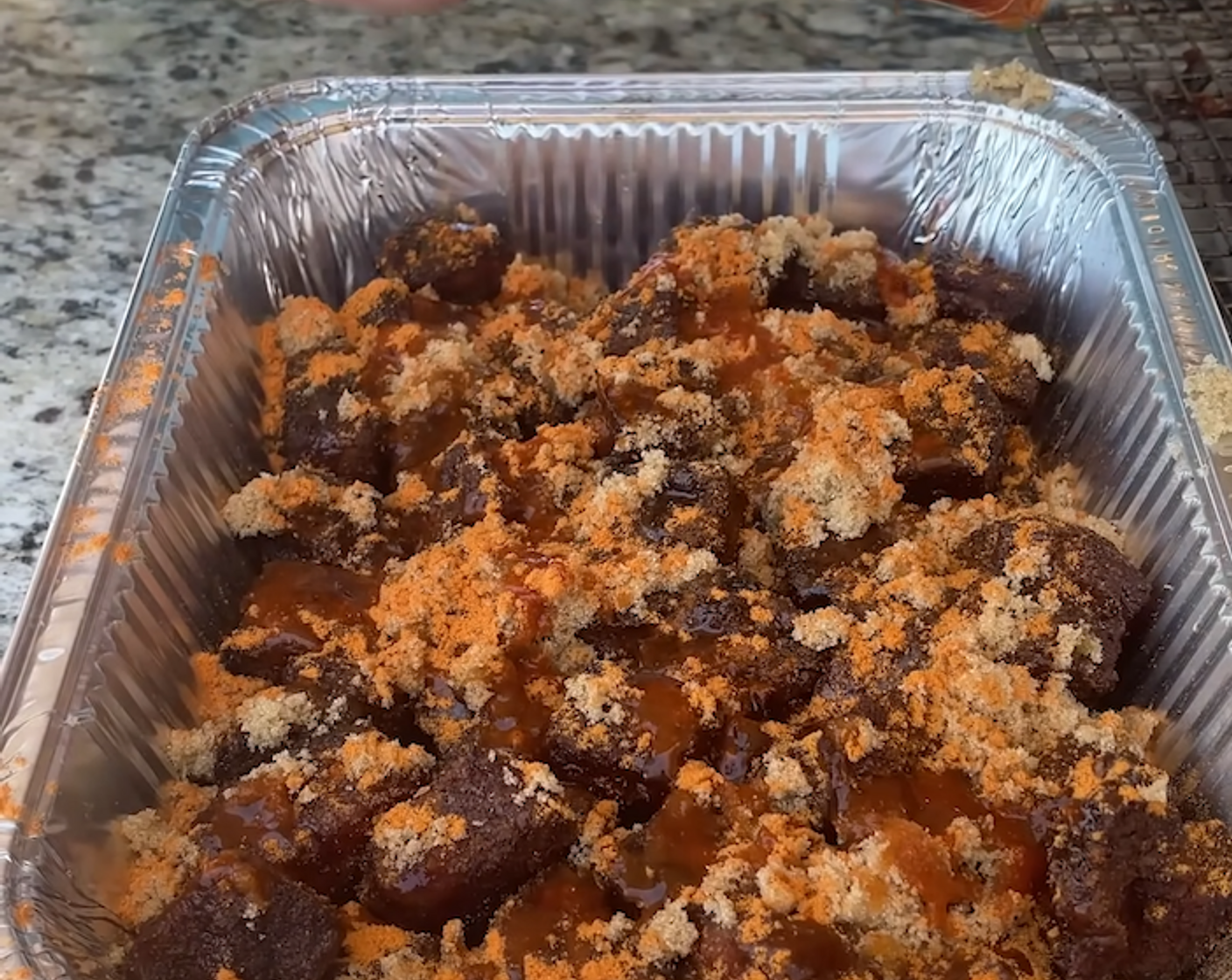 step 4 Place each piece of pork belly in a half-size aluminum pan and add Brown Sugar (1 cup), Honey (4 Tbsp), Hot Sauce (4 Tbsp), and Frank's® RedHot® Seasoning (1 Tbsp).