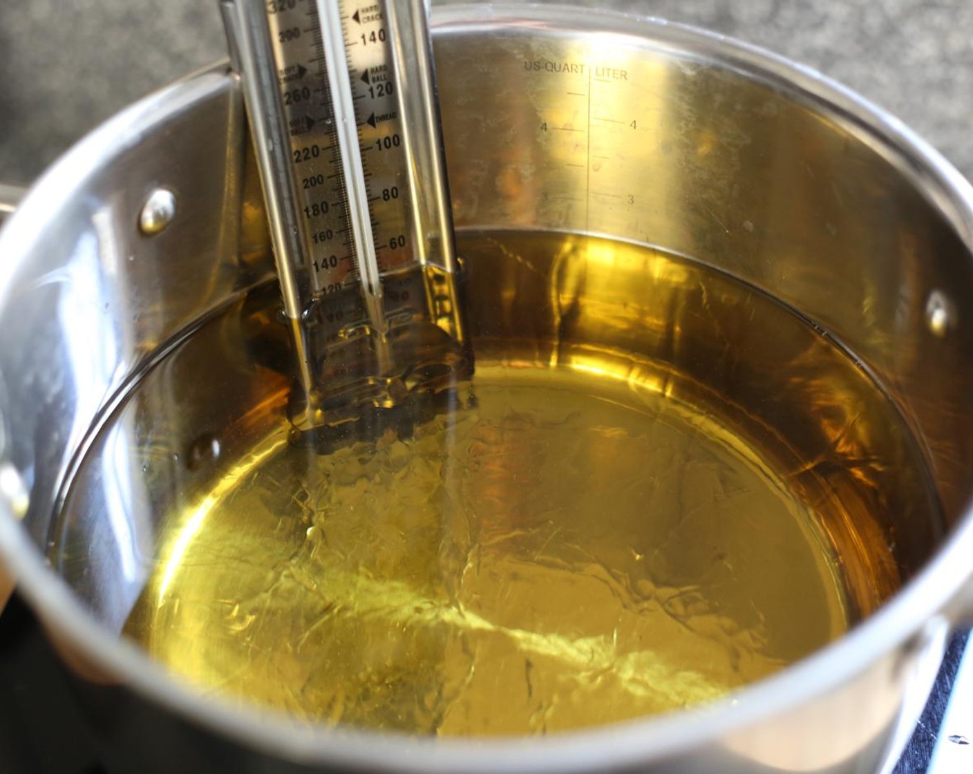 step 8 Heat Cooking Oil (as needed) in a large pot over a medium heat until it reaches 350 degrees F (180 degrees C).