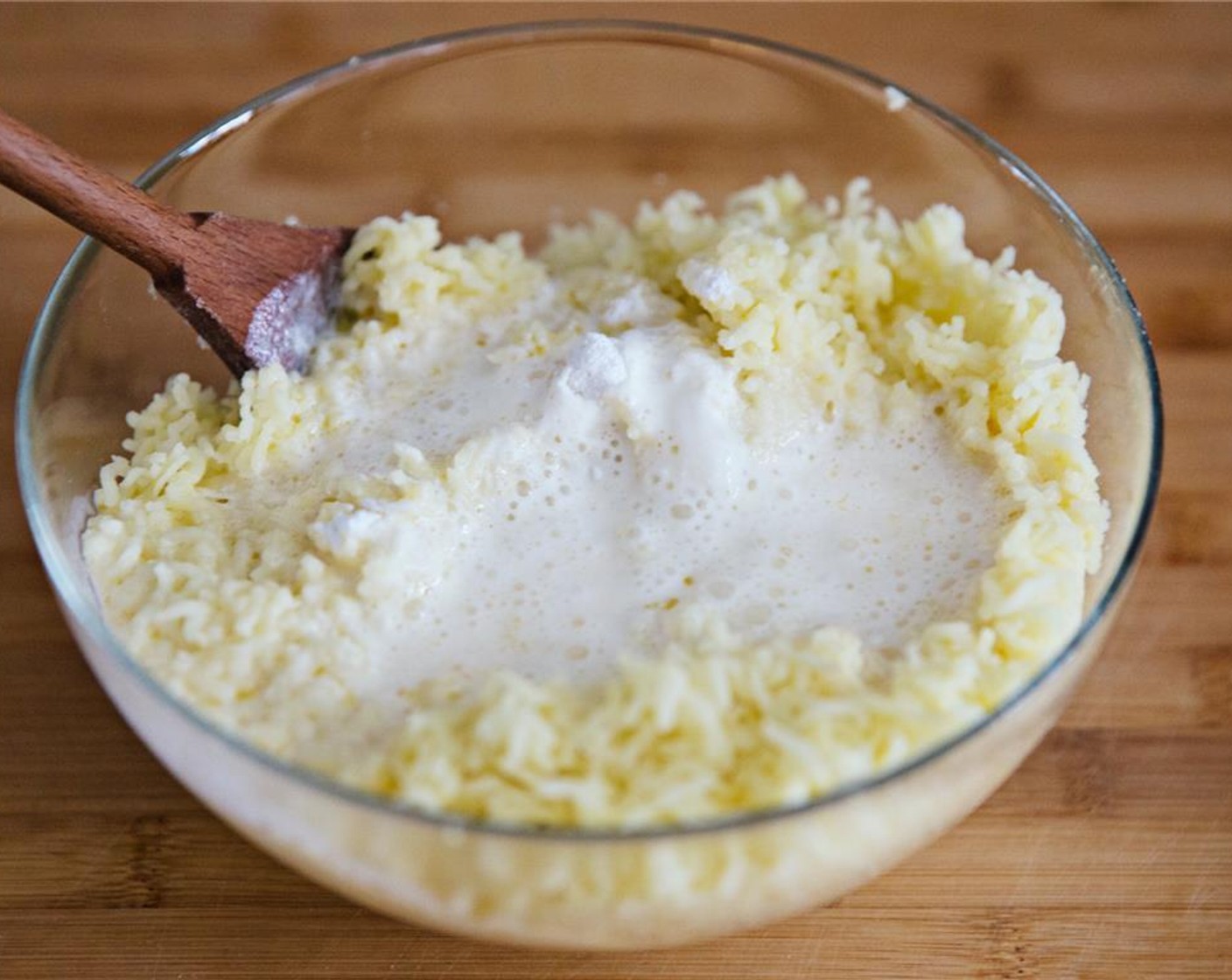 step 7 Pour the hot milk and butter mixture over the mashed potatoes.