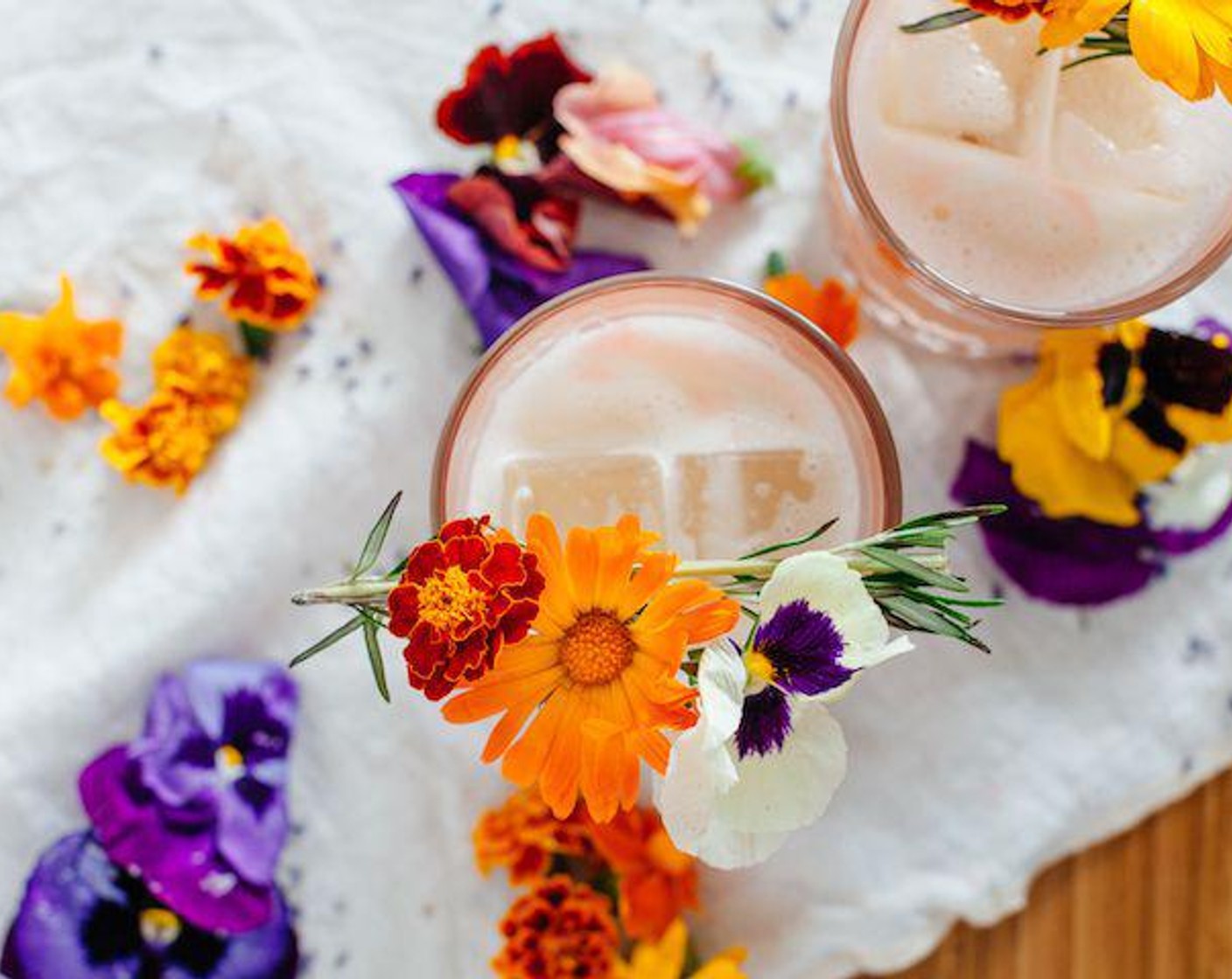 step 1 Shake Whiskey (1.5 fl oz), Almond Milk (3 fl oz), Lavender Extract (1 dash) and Simple Syrup (1 Tbsp) in a shaker for 15 seconds. Pour into glass and add ice. Garnish with Edible Flowers (to taste), Peychaud's Bitters (1 dash) and Fresh Rosemary (1 sprig).