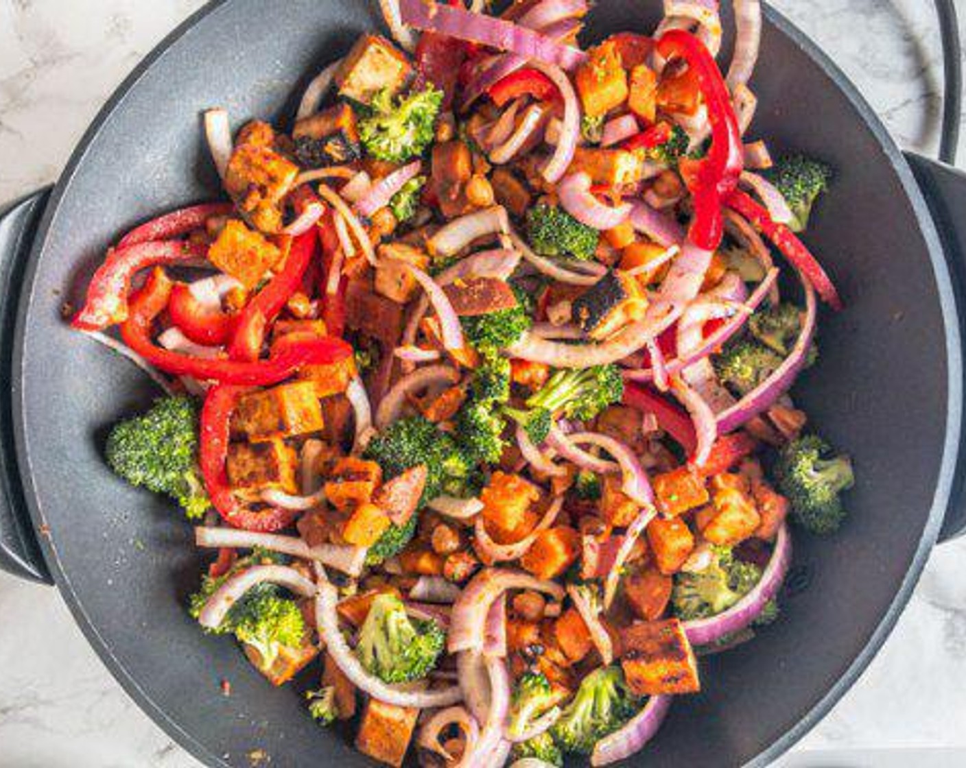 step 5 Add Broccoli (1 head), Red Onion (1), Bell Pepper (1), Oil (1 Tbsp), and Greek Seasoning (1 tsp). Mix together and cook 1 minute while covered.
