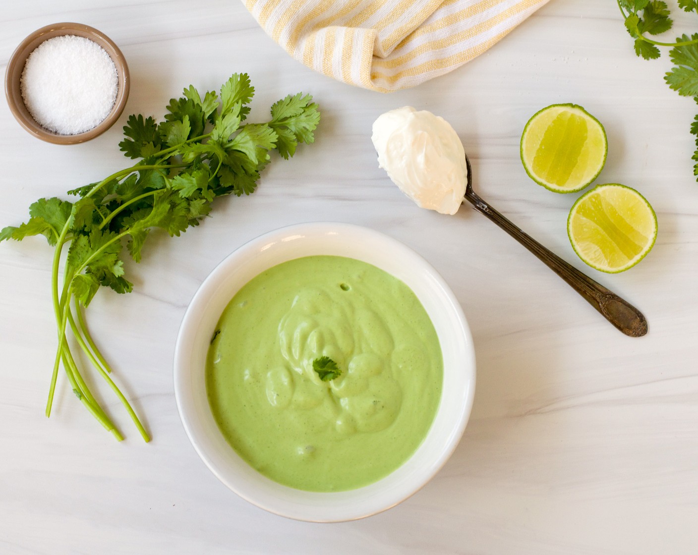 step 5 While the chicken is cooking, prepare the cilantro yogurt sauce: combine the Plain Greek Yogurt (1 cup), Fresh Cilantro (1 bunch), Limes (2) juice, Extra-Virgin Olive Oil (2 Tbsp), Honey (1 Tbsp), and Kosher Salt (1/2 tsp) in a blender and puree until smooth.