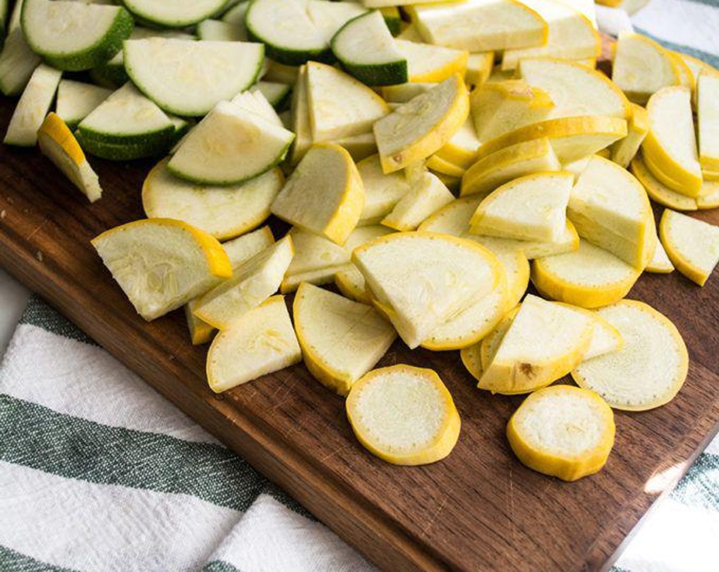 step 2 Add Zucchini (2) and Yellow Squash (2) and stir to combine. Cover with lid and cook for another 5-10 minutes, stirring occasionally.