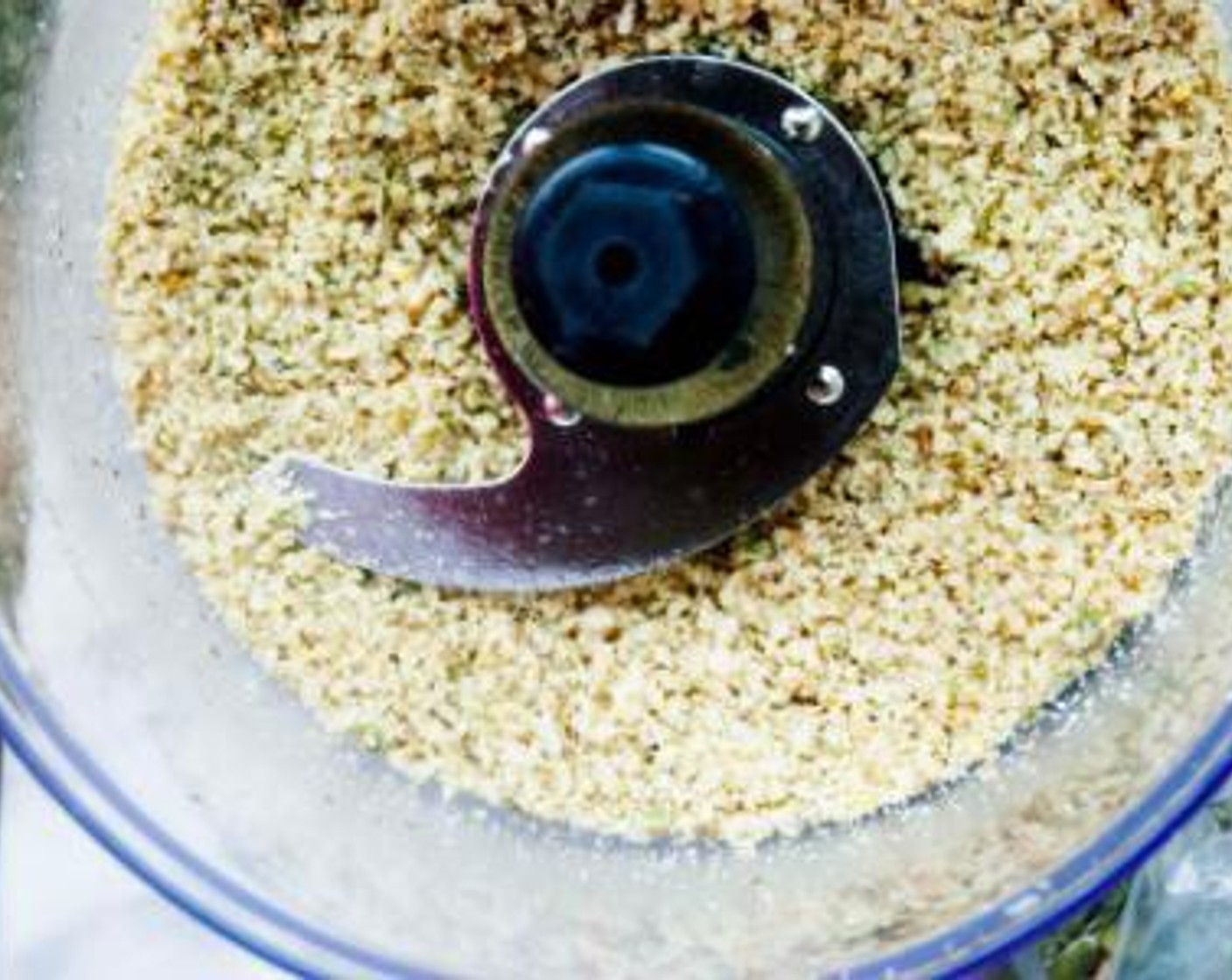 step 1 Add the Raw Walnuts (1 cup) and Pepitas (4 Tbsp) into a blender and process until finely ground.