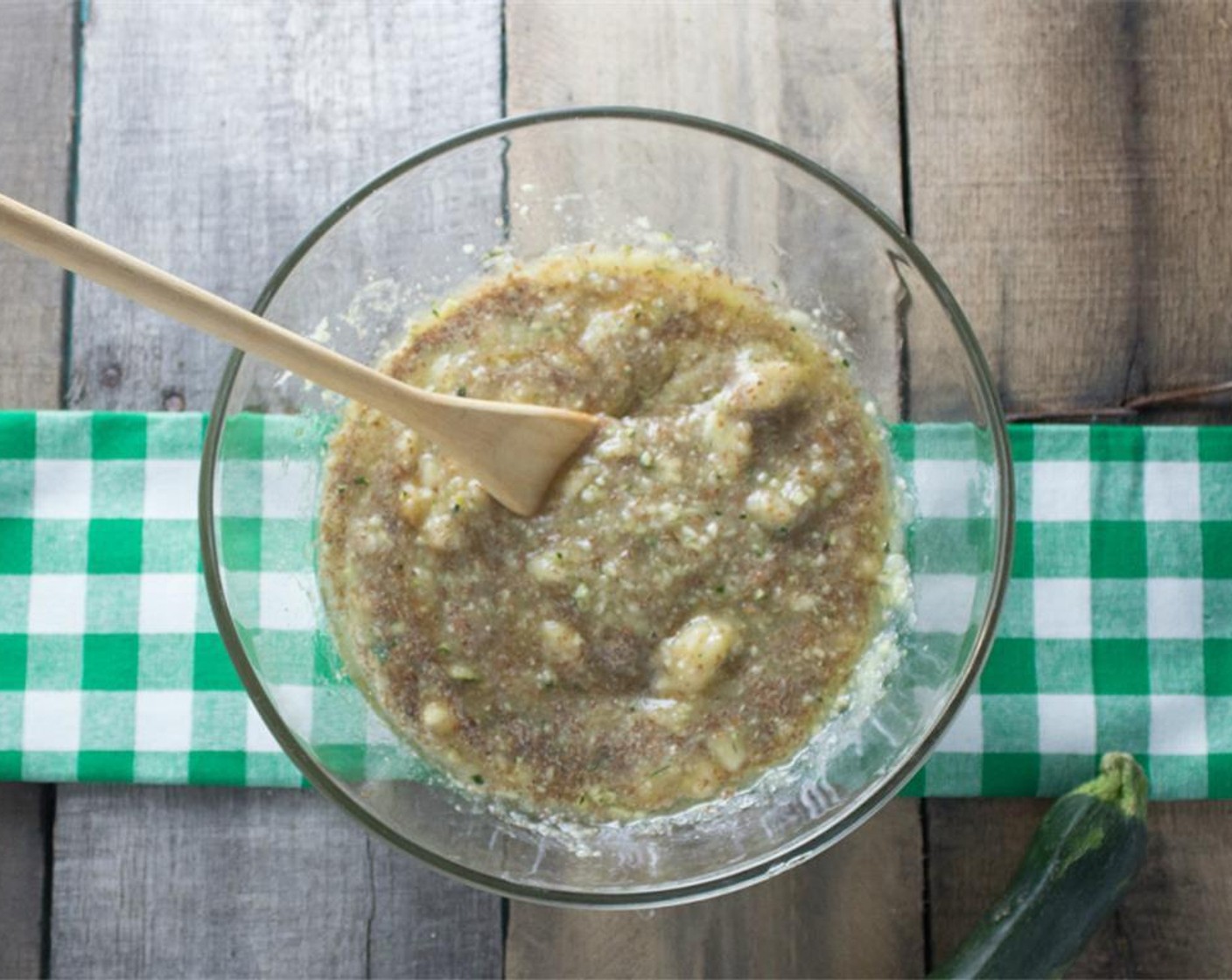 step 5 In a separate bowl prepare the wet ingredients. Mash the Bananas (2) and stir in Unsweetened Apple Sauce (3/4 cup), zucchini, Pure Maple Syrup (1/4 cup), Vegetable Oil (1/4 cup), and Vanilla Extract (1 tsp).