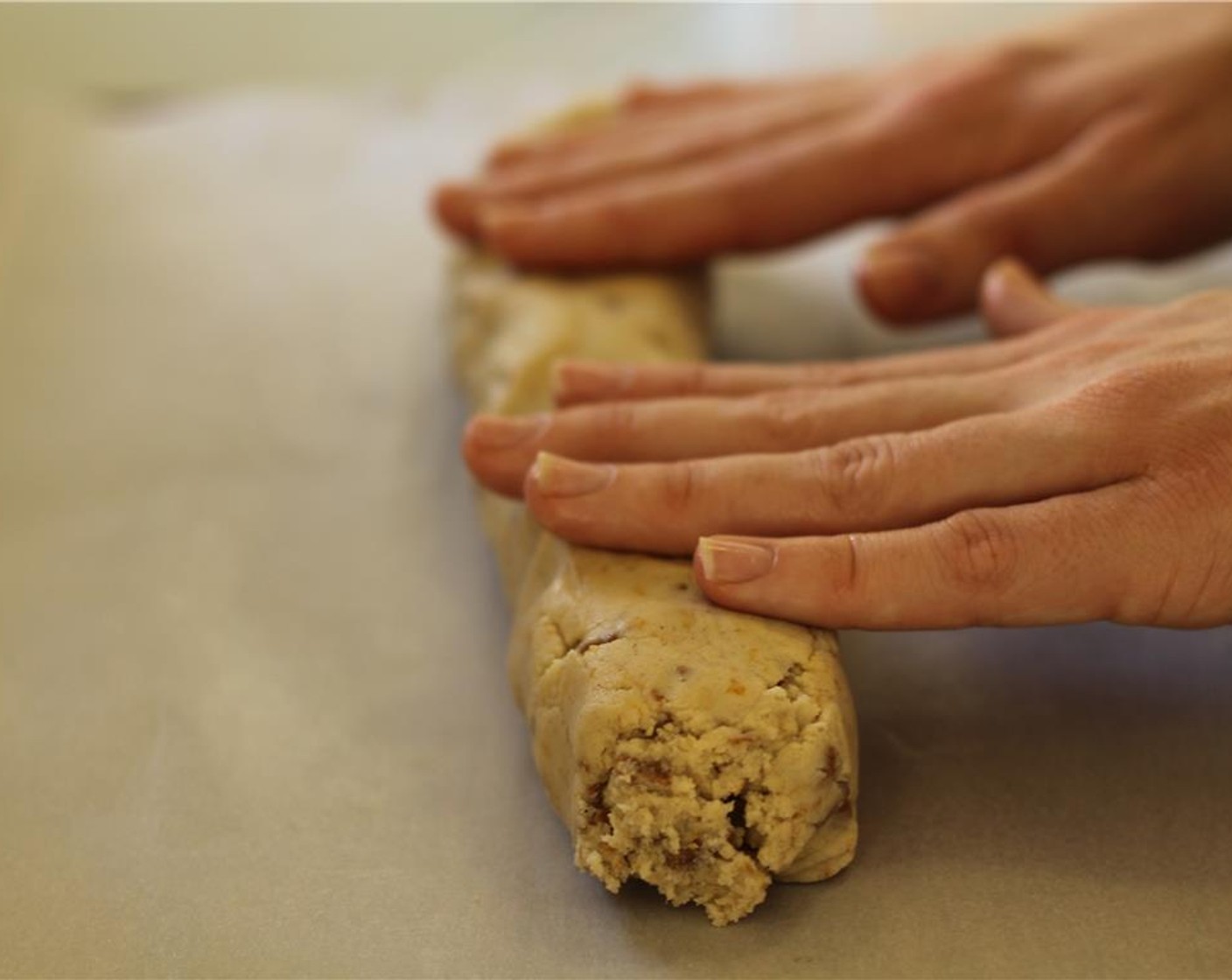 step 10 Roll half the dough into a log on a large cutting board or clean surface.