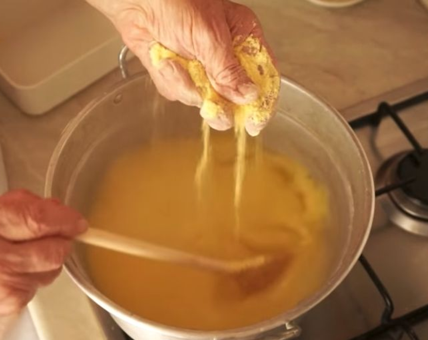 step 8 Don’t put all of the cornmeal in the polenta at once! You will see it start to grow in the water and eventually thicken, but the key is mix, mix mix!