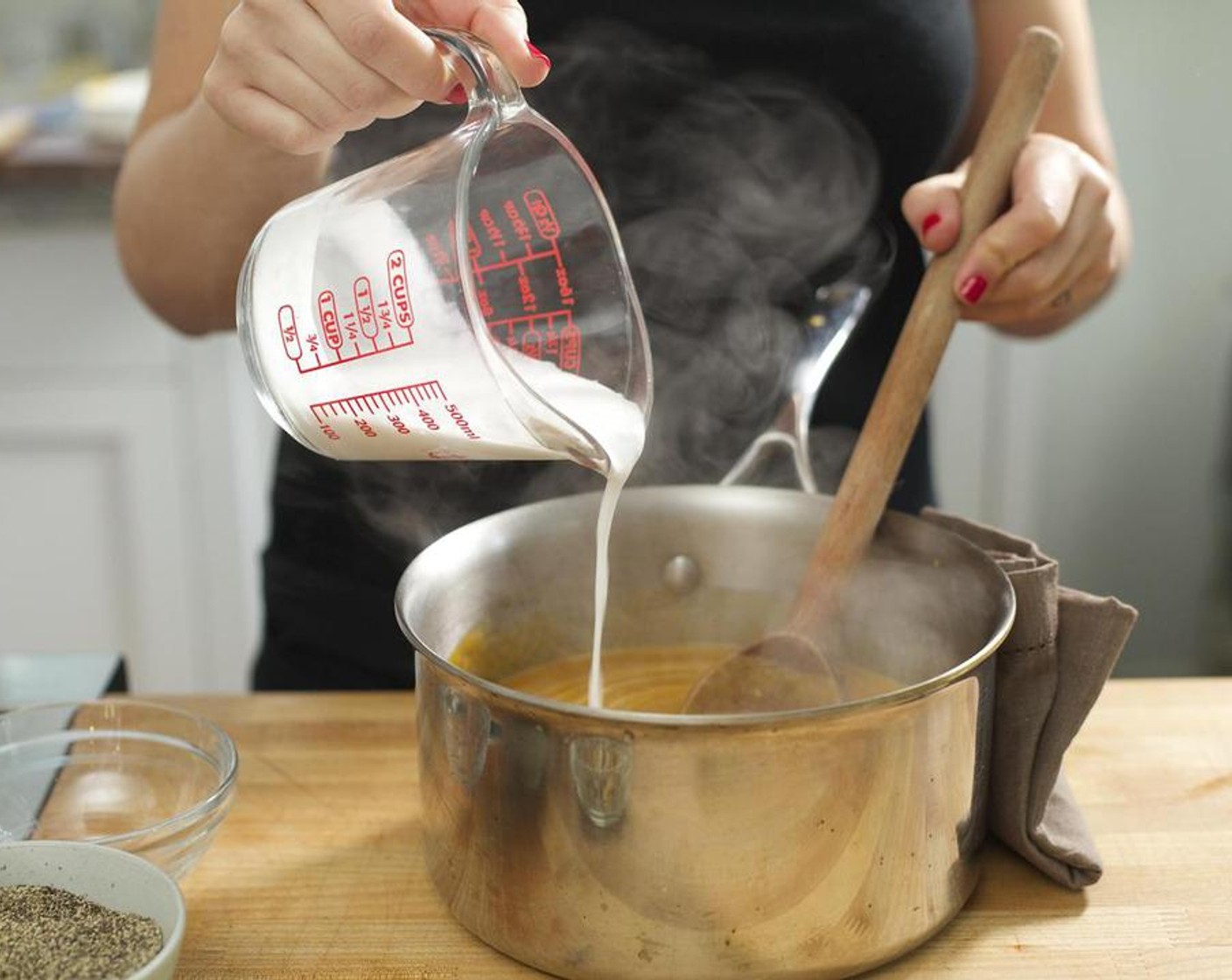 step 6 Once all the mixture has been blended, return the pureed soup back to the saucepan. Stir in Coconut Milk (1/2 cup) until it is well incorporated. Bring soup back to a quick boil while stirring and remove from heat. Do not burn!