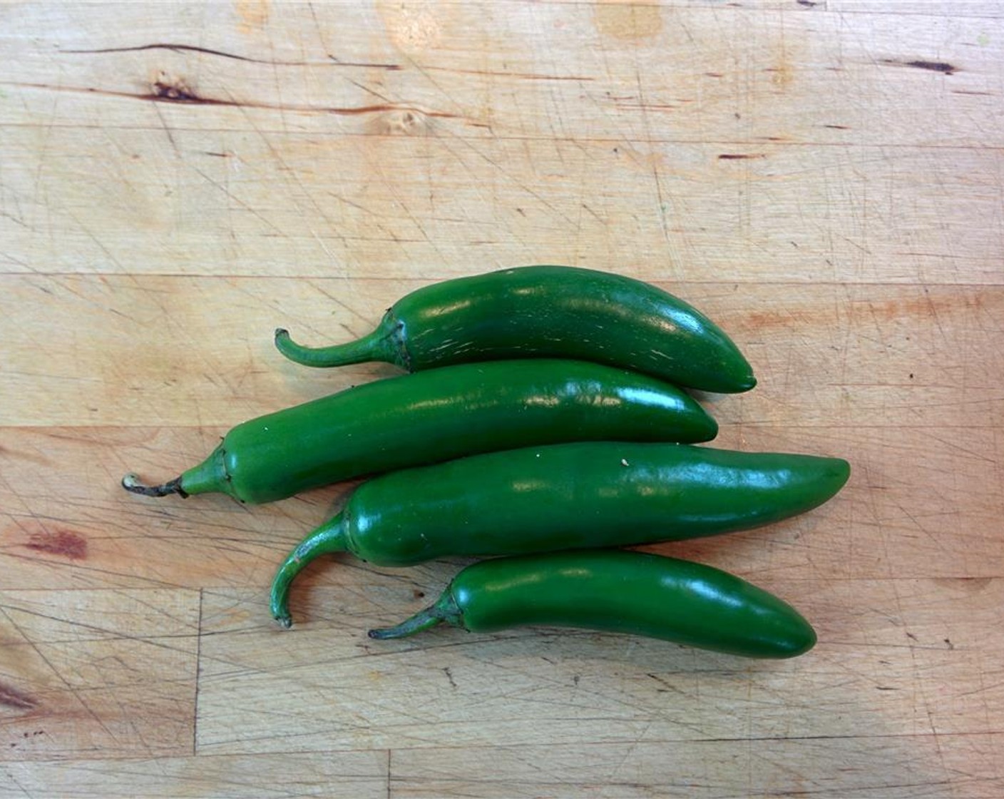 step 2 Slice the Serrano Chilis (4) and add them to the bowl.