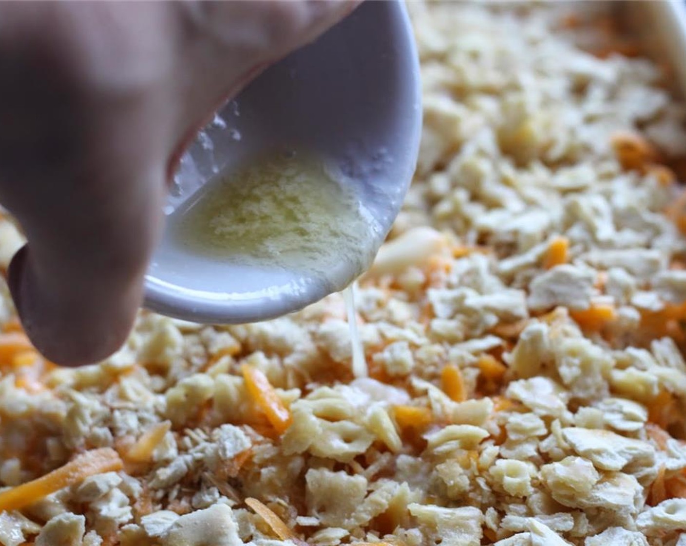 step 9 Drizzle 1/4 cup butter over crushed cornflake crumbs.