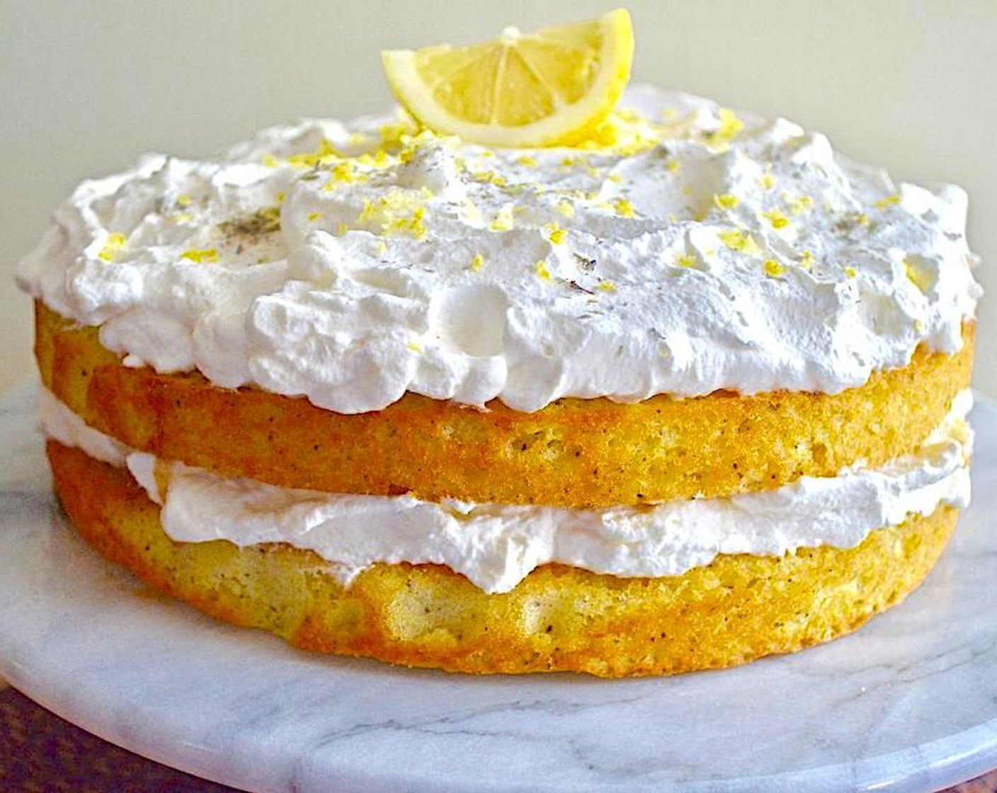 step 12 Place the second layer on flat side down. Poke holes and drizzle the remaining syrup into the sponge. Spread the remaining whipped cream on top, then sprinkle remaining 1 1/2 teaspoon of lemon zest and Ground Lavender (1 tsp) on top. Serve and enjoy!