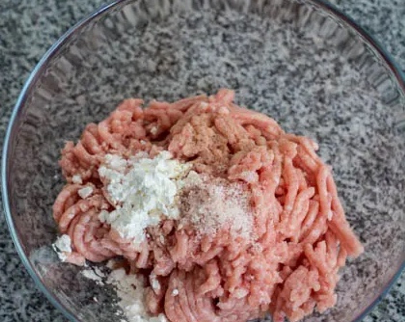 step 3 While waiting for the mushrooms to soak, add to a bowl Corn Starch (1 1/2 Tbsp), Salt (1 tsp), and Ground White Pepper (1 dash) to the Ground Pork (1 lb). Mix well, then allow to marinate for 20 minutes.