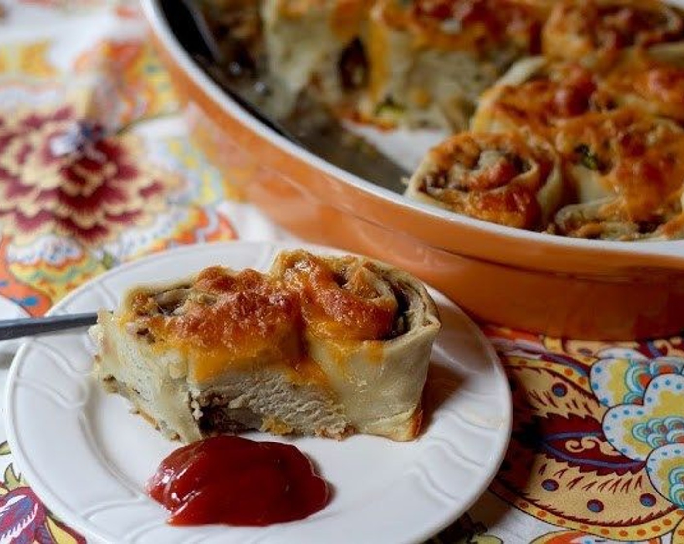 step 11 Remove from oven and lightly spritz water over the tops of the rollups. Cover with a clean dishtowel and let stand for 5 minutes. Uncover and serve with ketchup on the side.