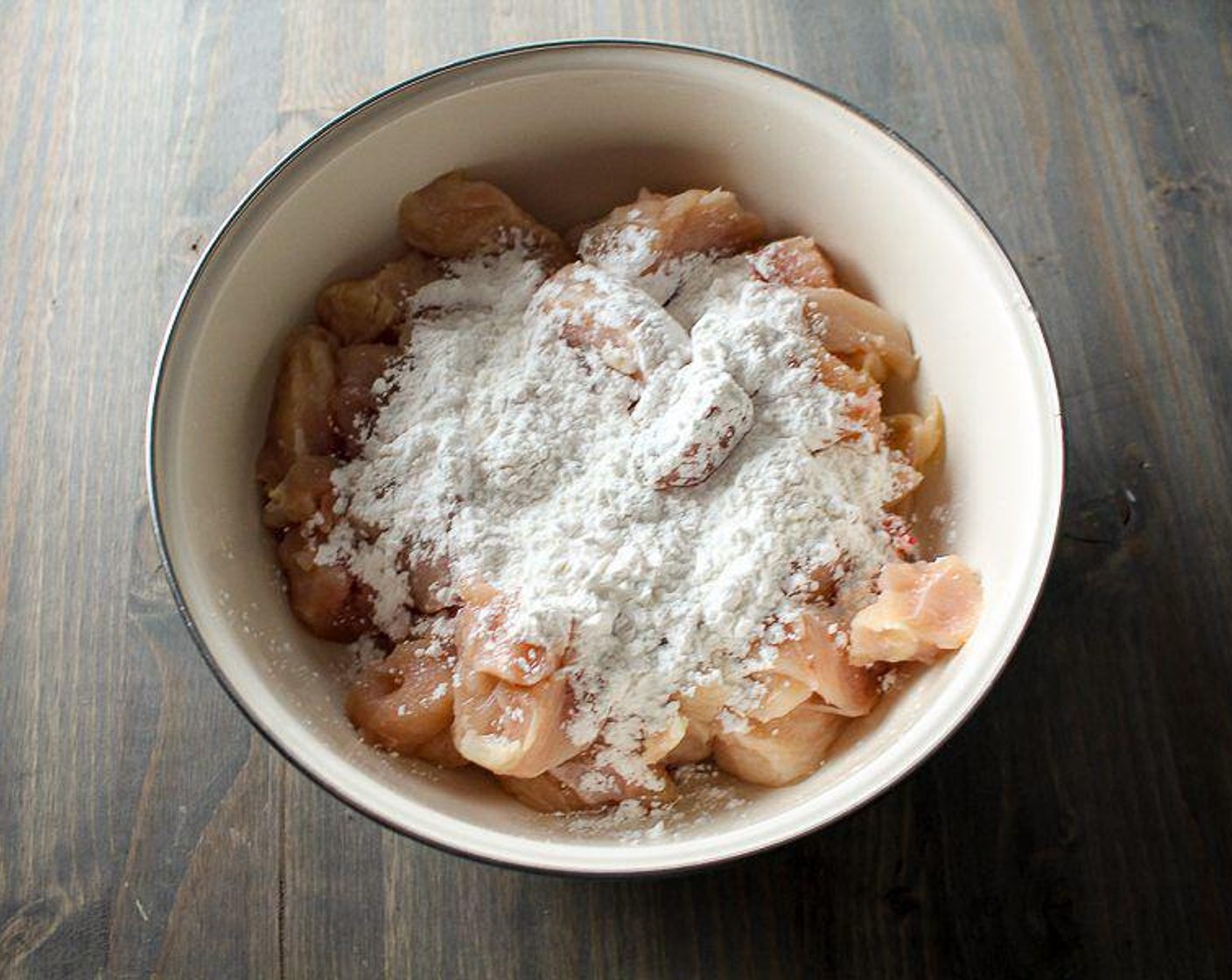 step 1 In a large bowl, toss the Boneless, Skinless Chicken Breasts (4) with Corn Starch (1/4 cup) until all pieces are well coated.