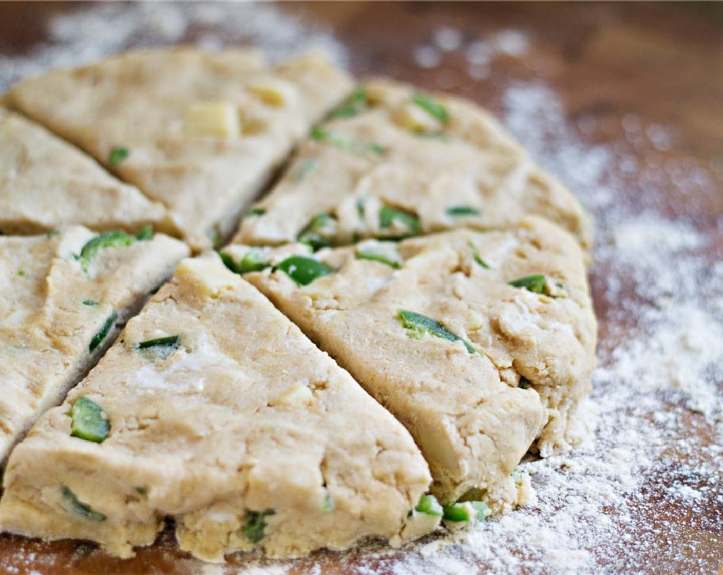 step 9 Gently shape the dough into a disc about 1½" thick. Cut the dough into six triangles, like a pizza, and move them to the cookie sheet.