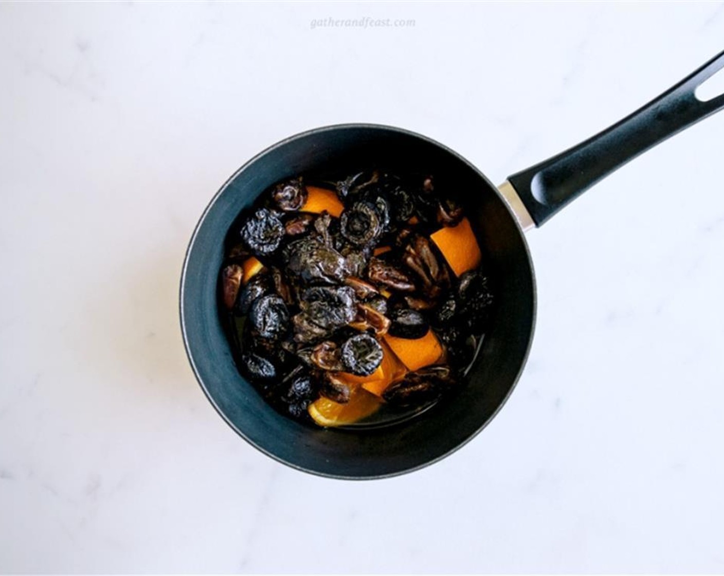 step 2 Combine pitted Dates (1 3/4 cups), pitted Prunes (1 2/3 cups), chopped orange slices and Water (1 1/4 cups) into a saucepan and bring to boil. Simmer for 10 minutes or until the water has evaporated and the dates have formed a thick paste.
