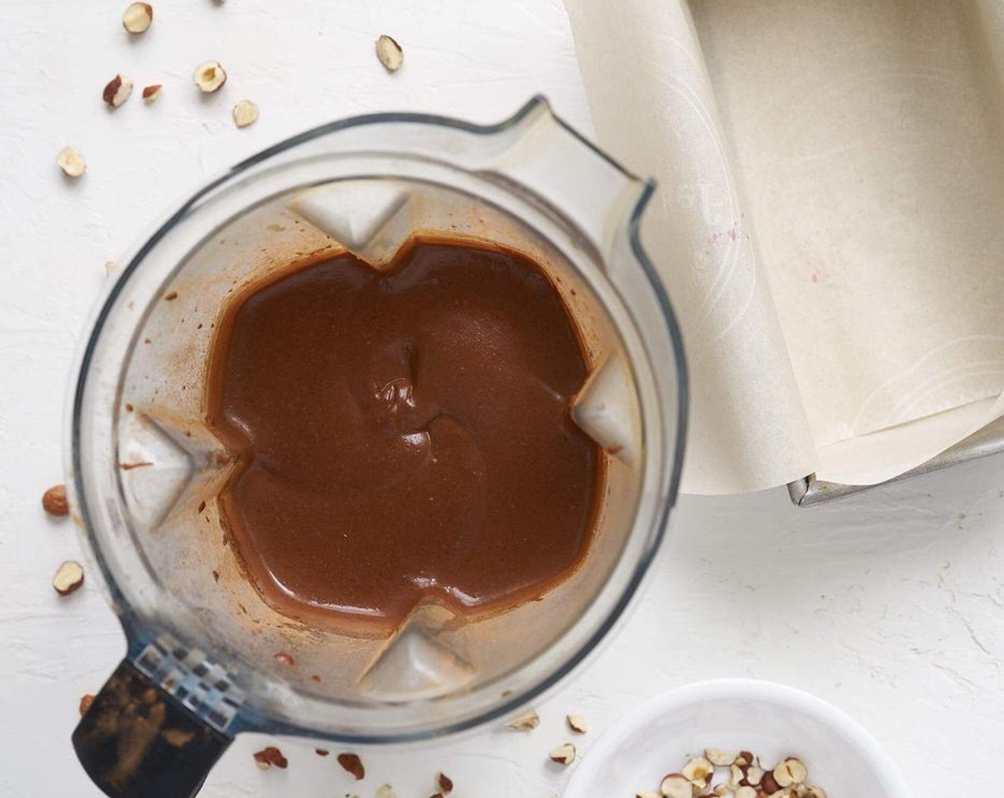 step 1 Place Hazelnut Butter (4 Tbsp), Raw Cacao Powder (4 Tbsp), Maple Syrup (4 Tbsp), Cashew Nuts (1 cup), Maca Powder (1 Tbsp) and Full-Fat Coconut Milk (1/2 can) into a high powder blender and give a whirl until smooth and creamy.