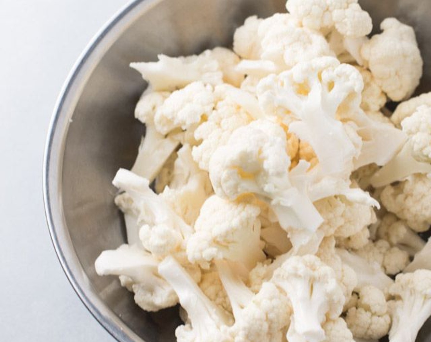 step 2 Break Cauliflower (1 head) up into bite-sized pieces.