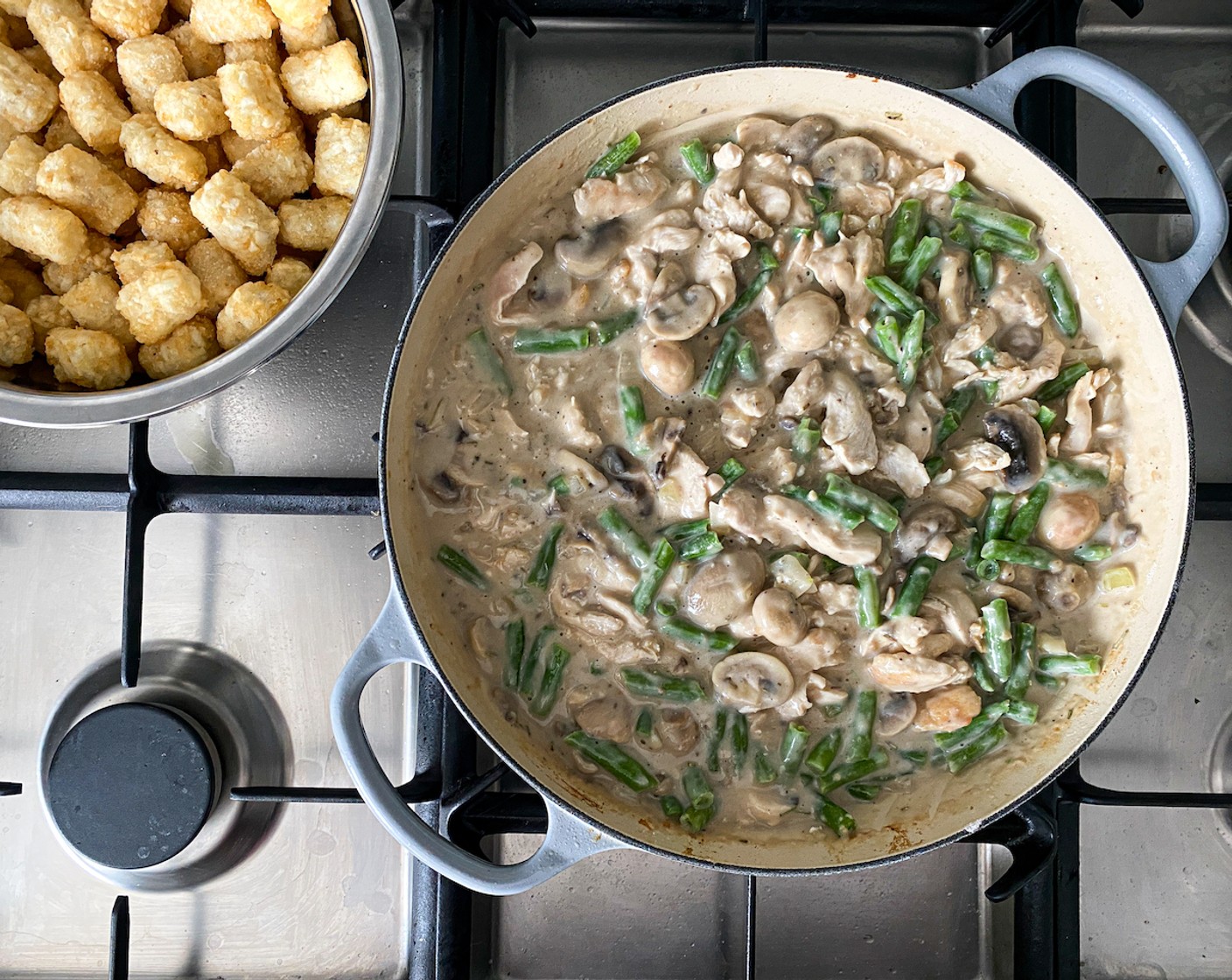 step 6 Add the browned chicken and Frozen Green Beans (2 cups). Stir until well combined. Simmer until the mixture starts bubbling again.