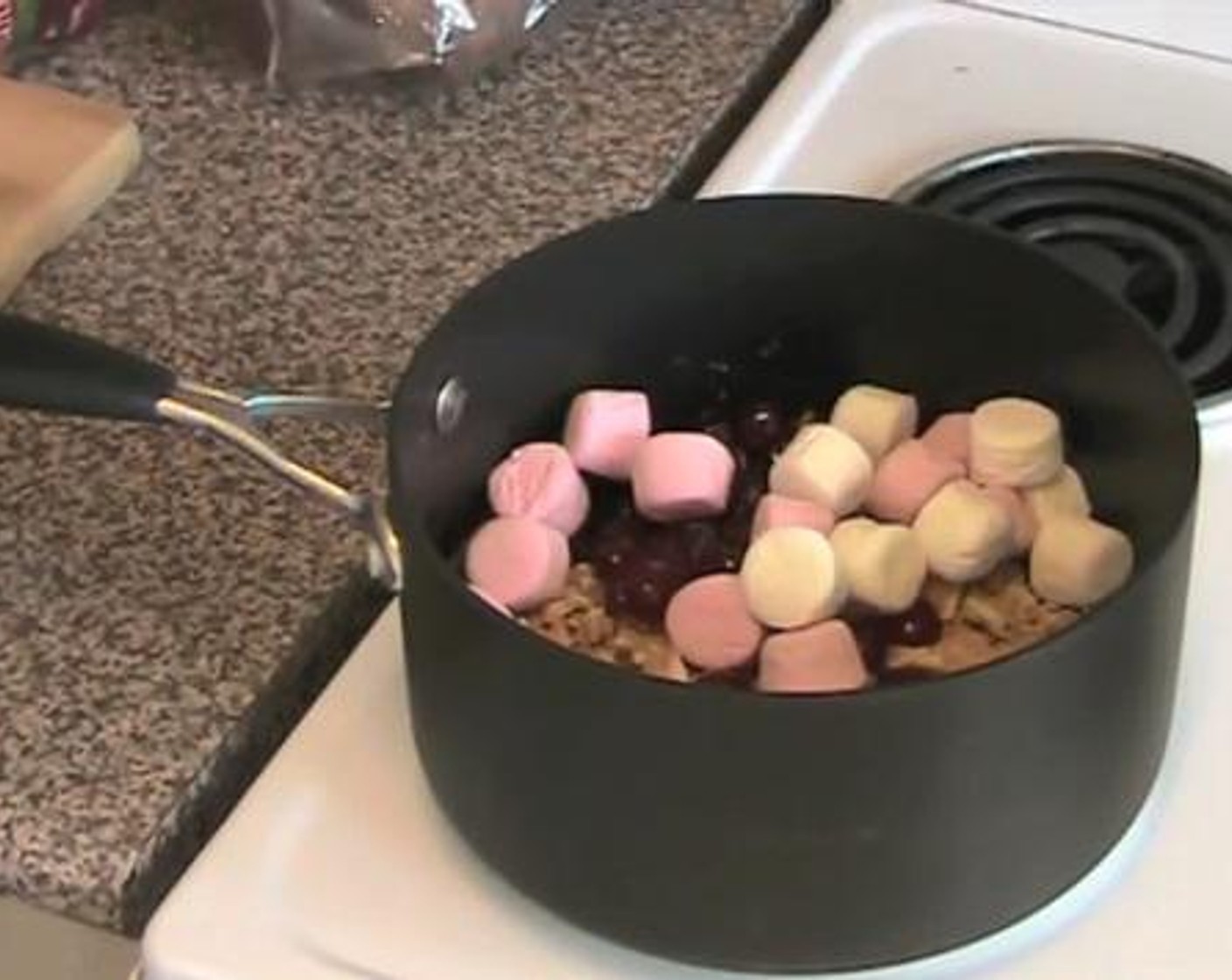 step 3 Add and mix together the cookie crumbs, Glace Cherry (1/2 cup), and Mini Marshmallows (2 1/2 cups) into the chocolate mixture.