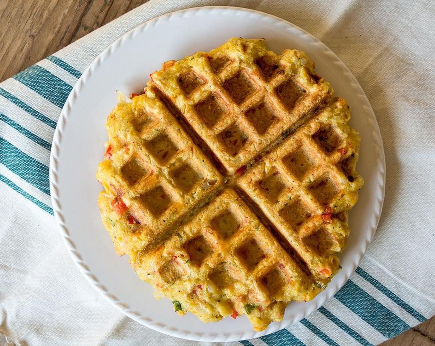 step 4 Once the waffle maker is hot and the batter is ready, lightly spray the top and bottom with Coconut Oil Cooking Spray (as needed), then pour half the batter into the waffle maker and cook until golden brown and slightly crispy.