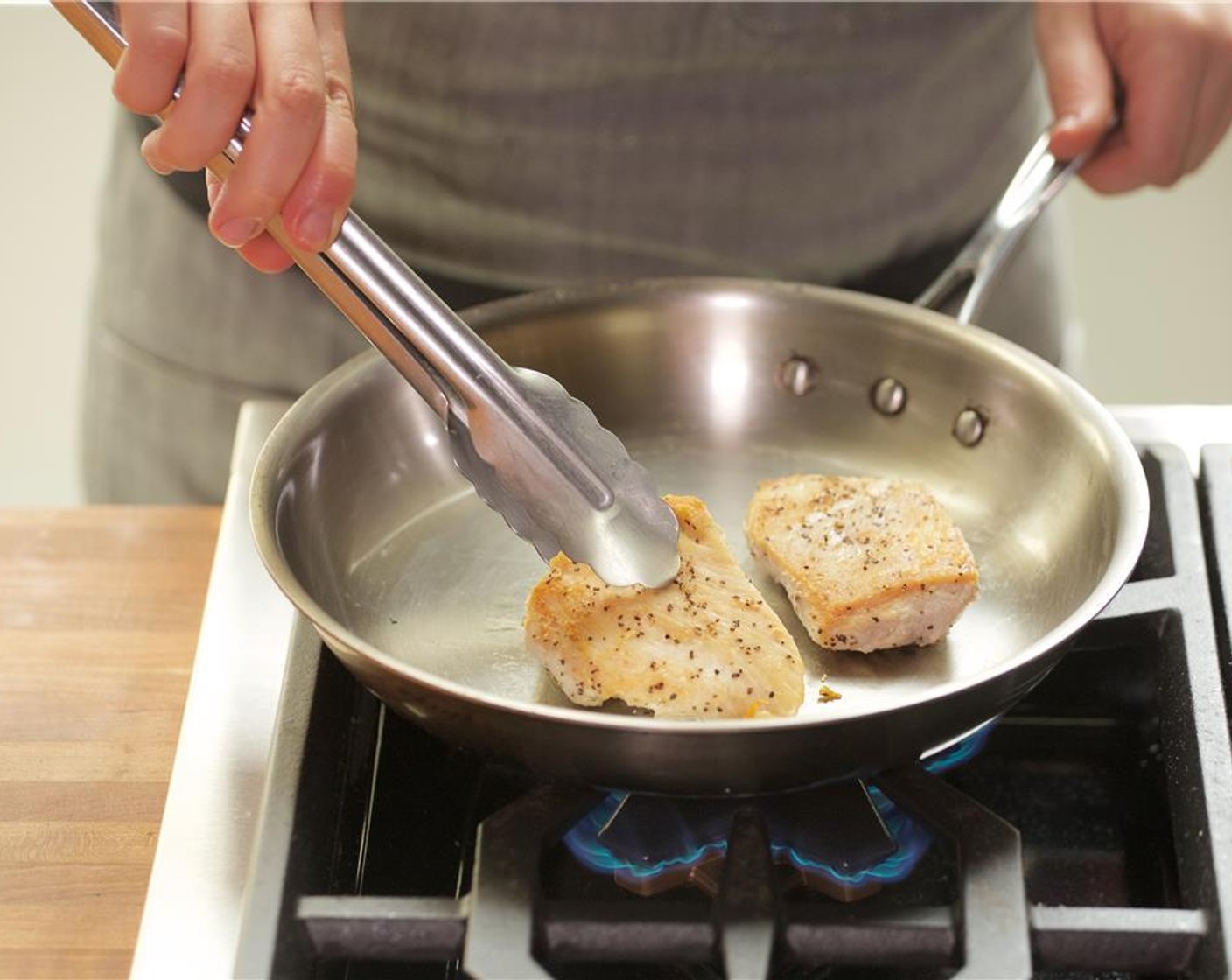 step 13 Add the chicken and sear on each side for about five minutes.