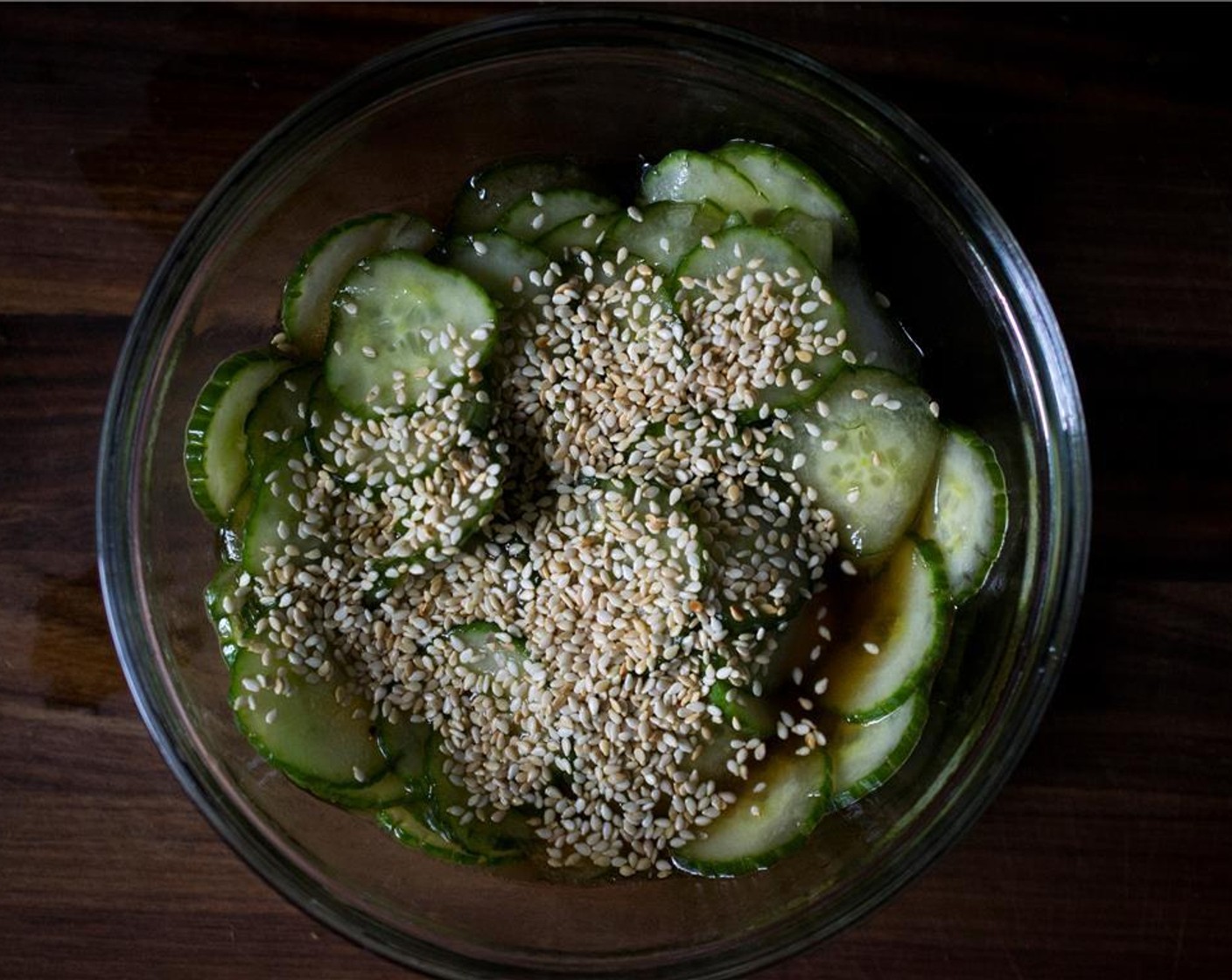 step 6 Add the cucumber slices to the vinegar mixture and sprinkle with the toasted Toasted White Sesame Seeds (1 Tbsp).