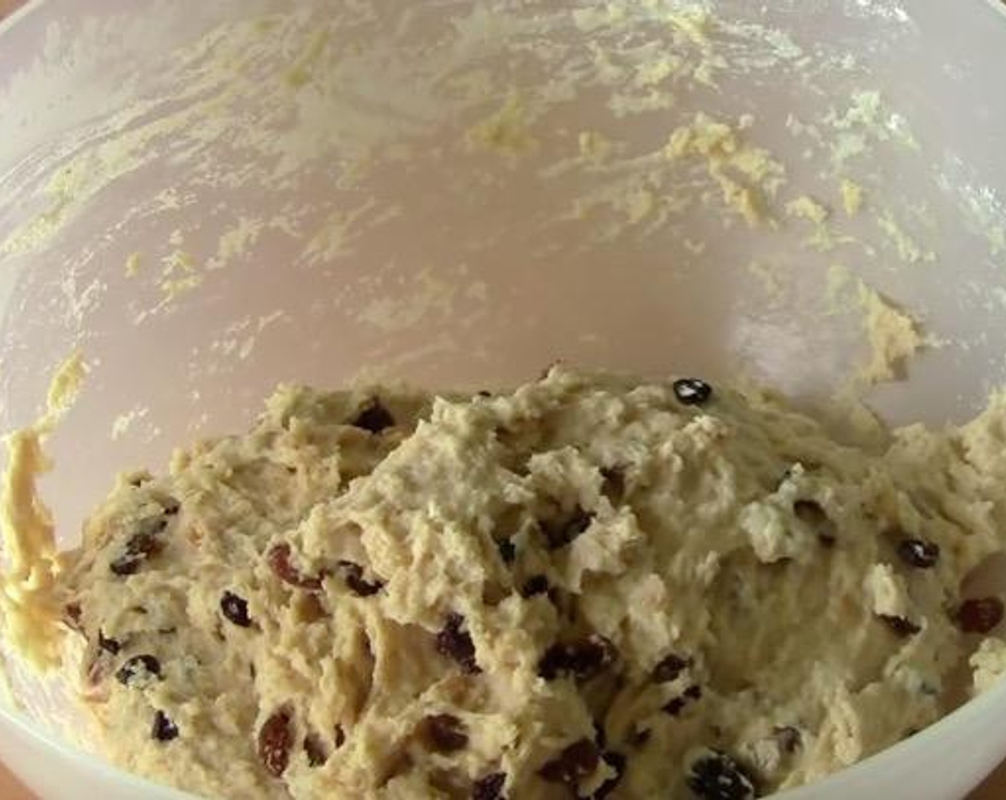 step 4 Add the mixture of warm milk, melted butter, and egg into the well and mix everything together. Turn it out onto a lightly floured surface and knead for about 10 minutes or until it's nice and smooth and not so sticky.