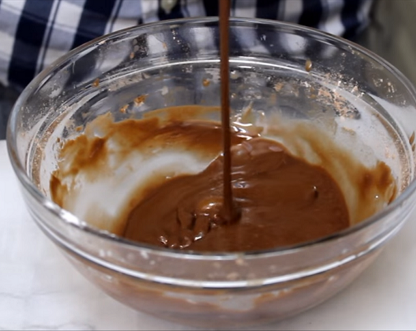 step 14 To make the chocolate glaze, add Powdered Confectioners Sugar (1 cup), Unsweetened Cocoa Powder (1 Tbsp), Vanilla Extract (1 tsp), Milk (to taste) to a bowl and mix together.