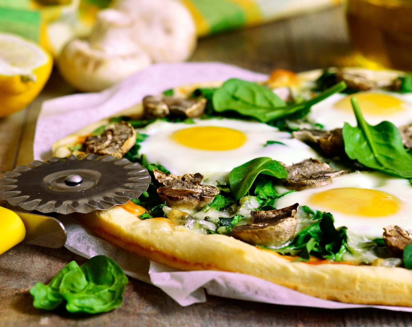 step 12 Top the pizza with the eggs. Cut through the eggs into 8 slices.