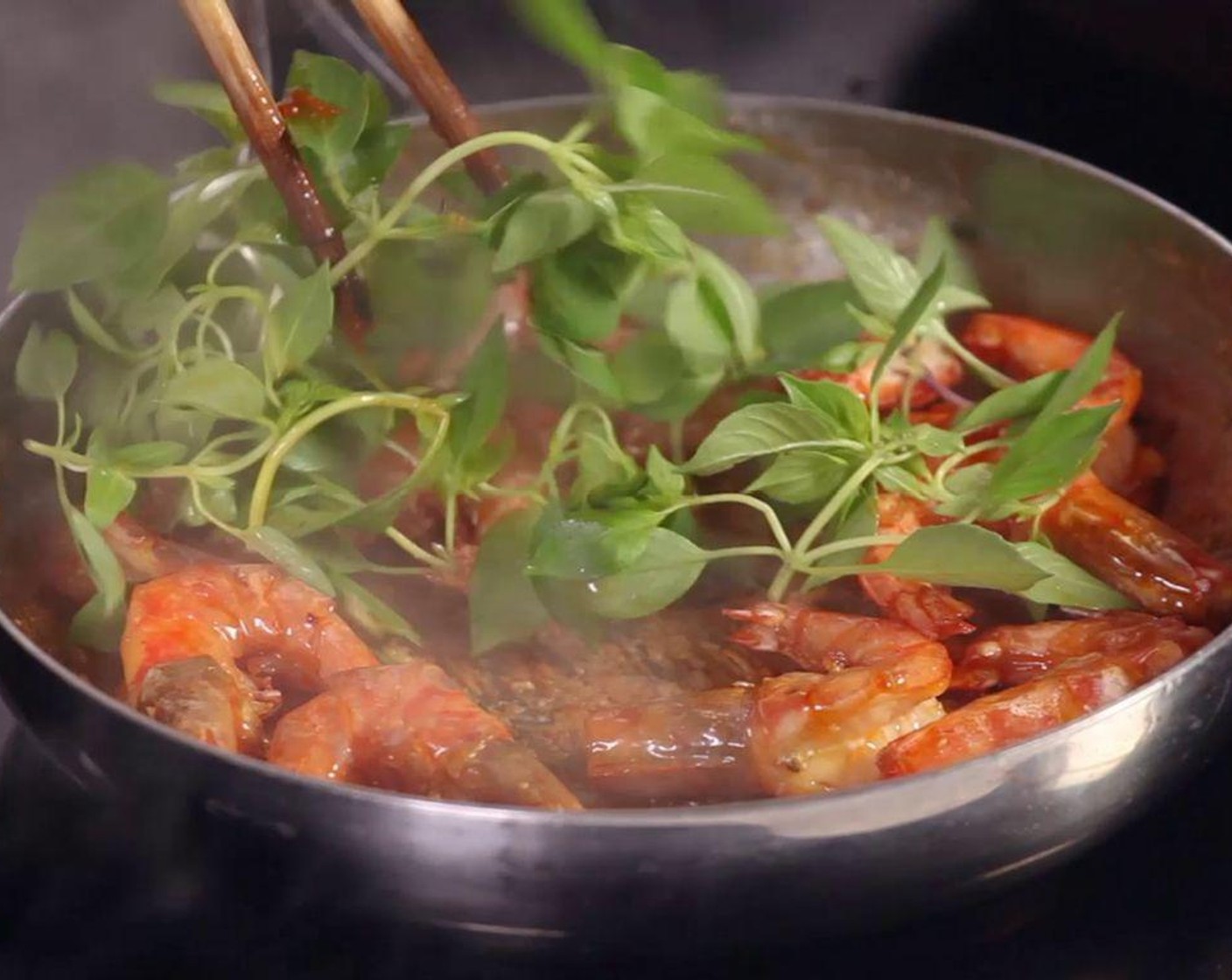 step 5 In a pan, sauté Garlic (2 cloves) in hot Cooking Oil (1 Tbsp), then add shrimp and sauce on high heat, add Rosemary Leaves (1 cup), and the fried rosemary leaves, garlic, and chili pepper.