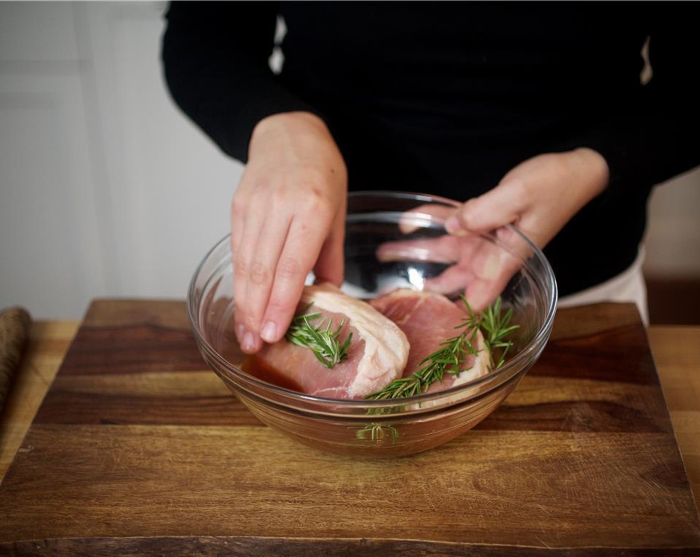 step 3 Pat the Bone-In Pork Chops (2) dry with paper towels and place in the marinade. Let marinate for thirty minutes minimum or up to four hours, if desired.