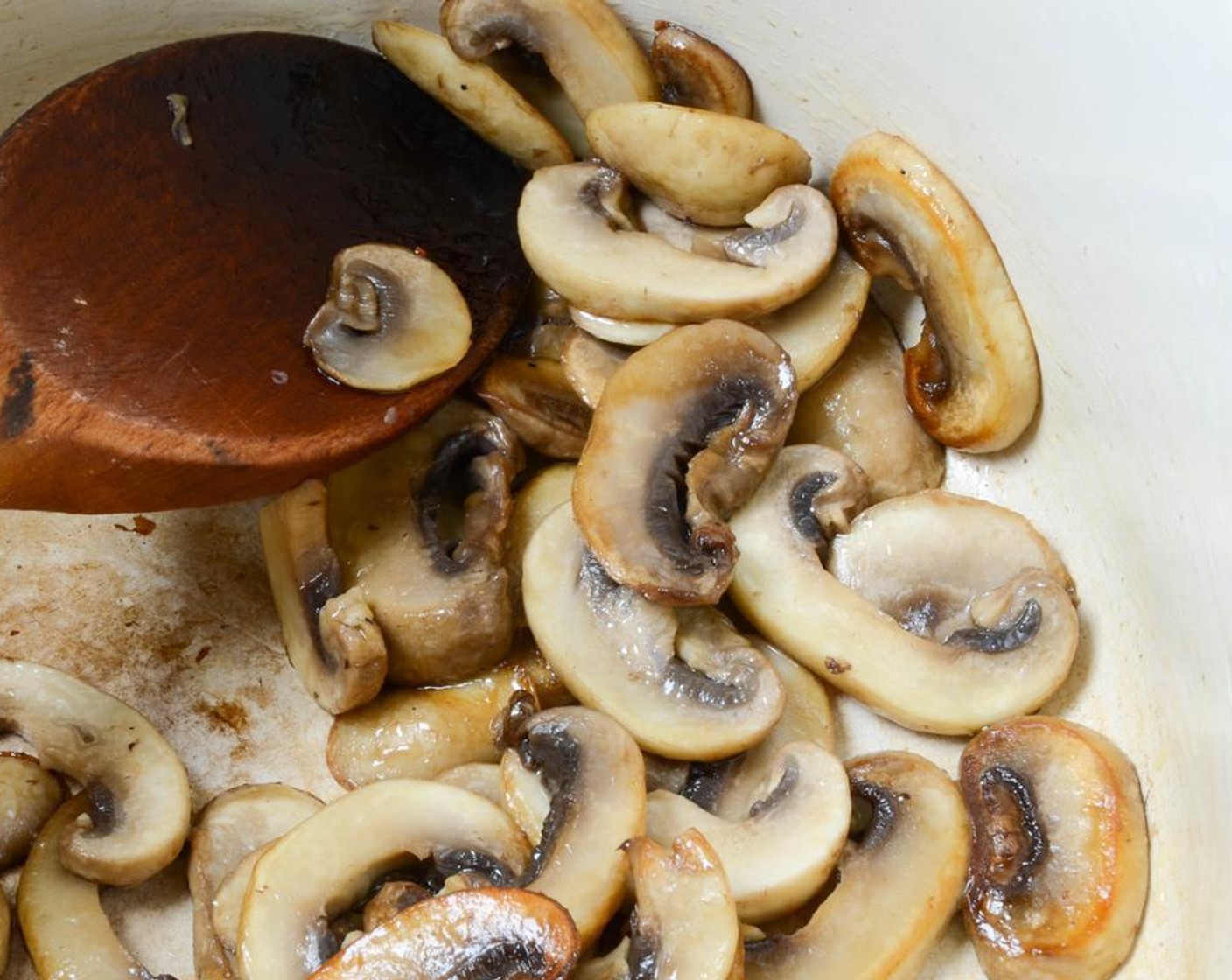 step 1 In a large dutch oven or heavy soup pot, heat Olive Oil (1 Tbsp) over medium heat. Add Button Mushrooms (2 1/4 cups) and a pinch of salt.