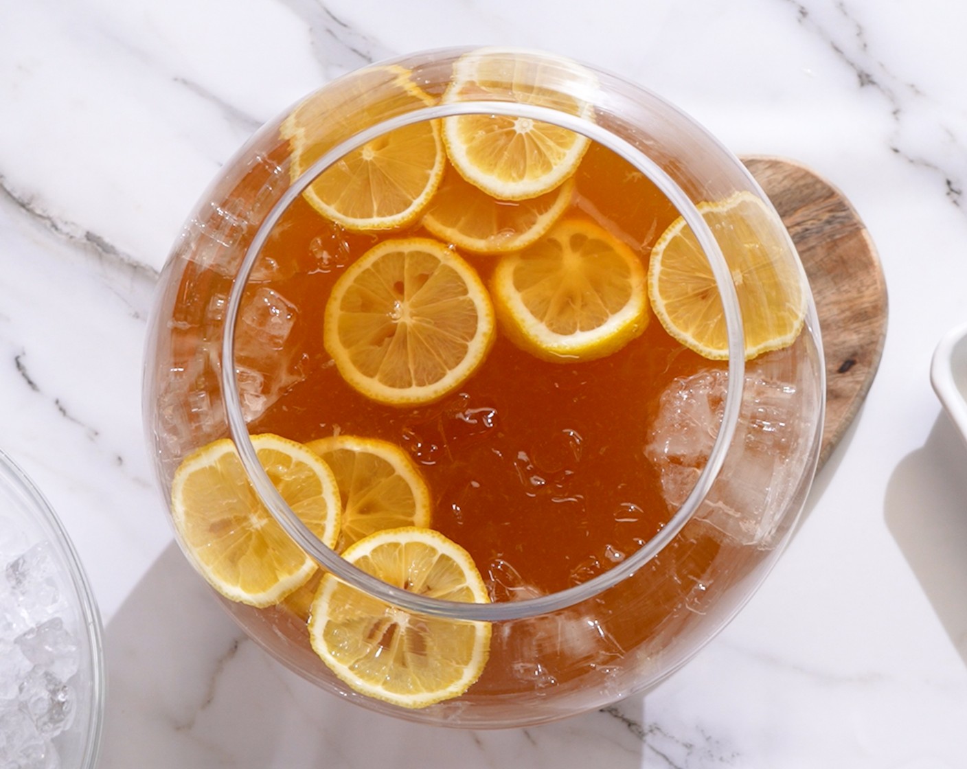 step 2 Into the same bowl, add Ice (6 cups) and Lemon (1).