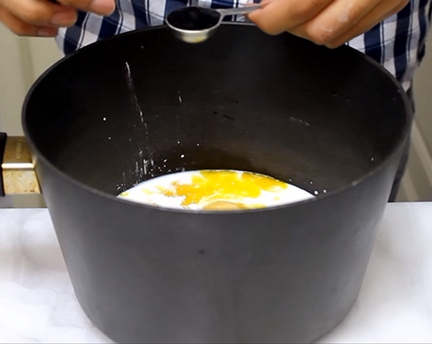 step 6 To make the custard, add Milk (1 cup), Granulated Sugar (1/4 cup), yolks from the remaining Eggs (2), Salt (1 pinch), Corn Starch (2 Tbsp), Vanilla Extract (1 tsp) to a large saucepan and mix.