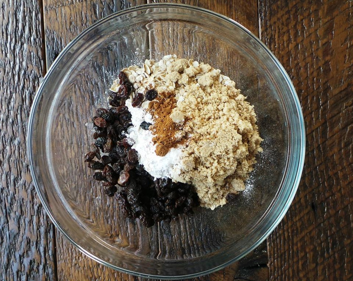 step 1 In a large bowl, mix together the All-Purpose Flour (125 g), Old Fashioned Rolled Oats (90 g), Brown Sugar (110 g), Baking Powder (2 tsp), Baking Soda (1/2 tsp),Ground Cinnamon (1 tsp), and Raisins (70 g).