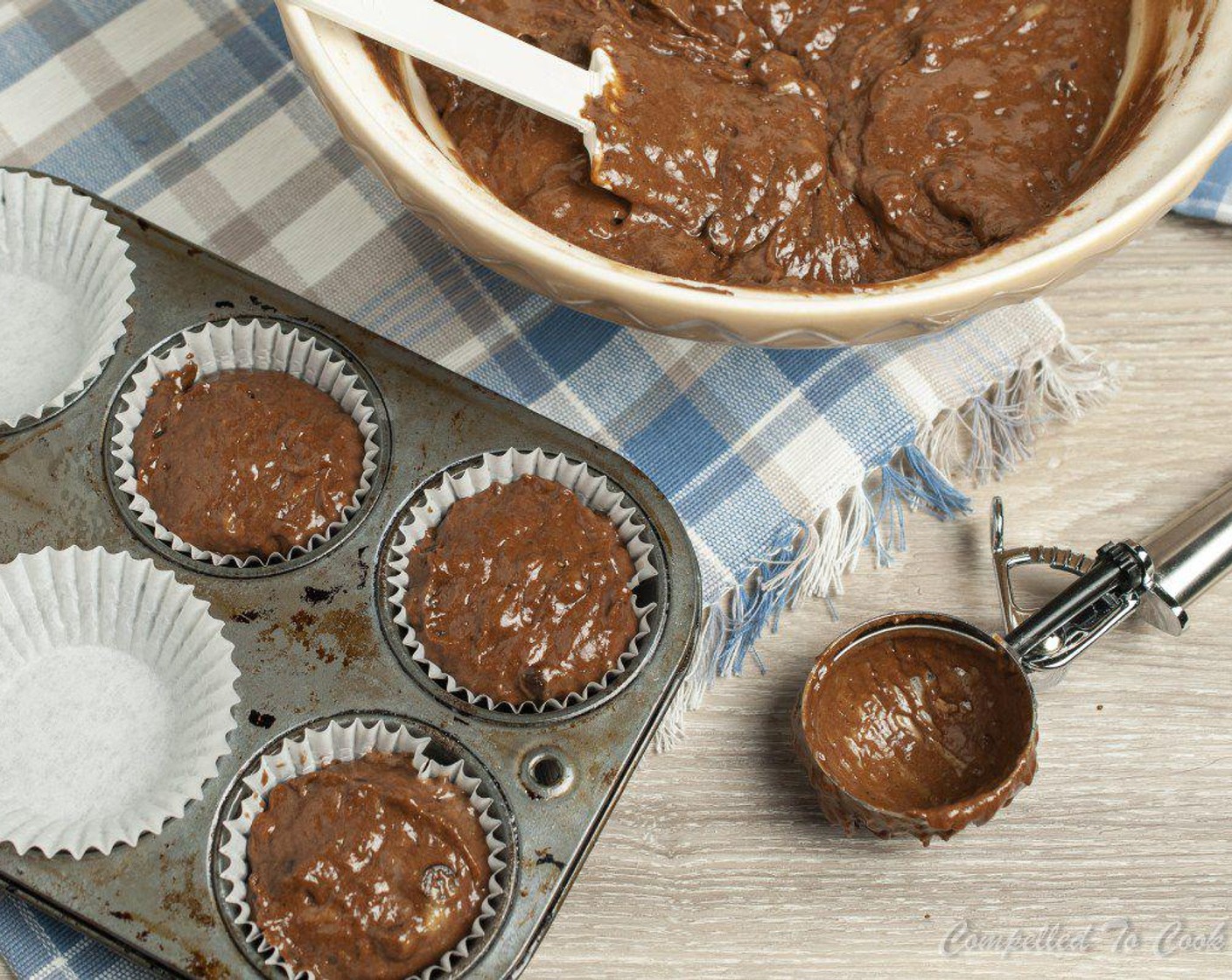 step 6 For large muffins, scoop a generous 1/3 cup of batter per muffin tin. For smaller muffins, use a 1/4 cup of batter per muffin tin.