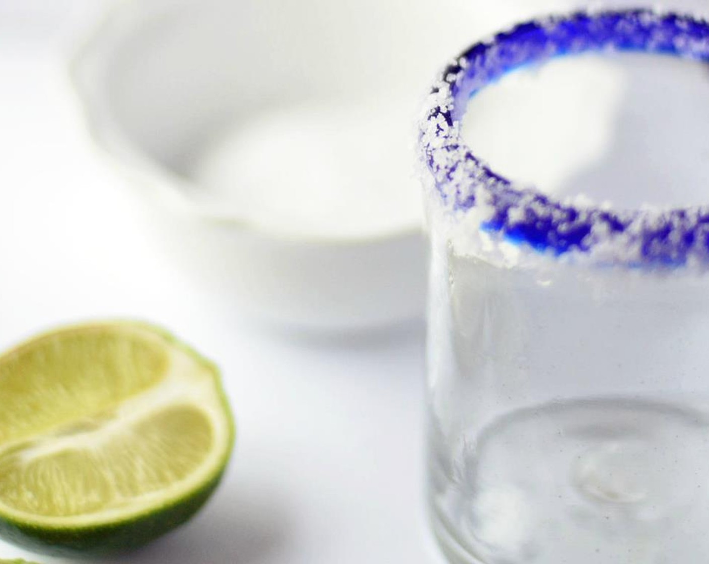 step 6 Pour a few tablespoons of Kosher Salt (to taste) onto a small plate or shallow bowl. Take a one of the Lime Wedge and run it along the rim of your cocktail glass. Dip rim of cocktail glass into salt, pressing gently.