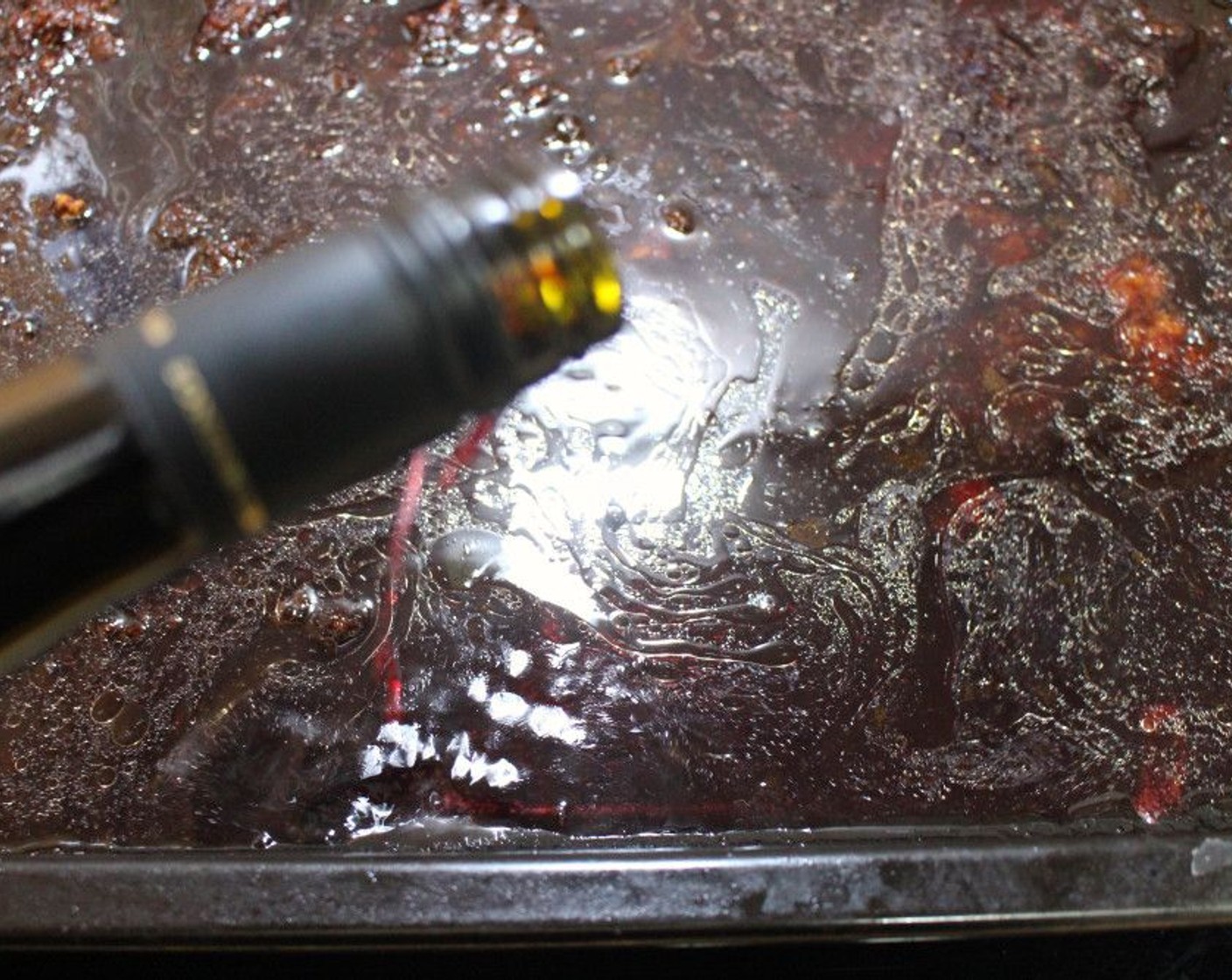 step 6 Add Red Wine (2 cups) to the bottom tray used to roast the duck. Simmer until all the fond has loosened from the bottom of the tray.