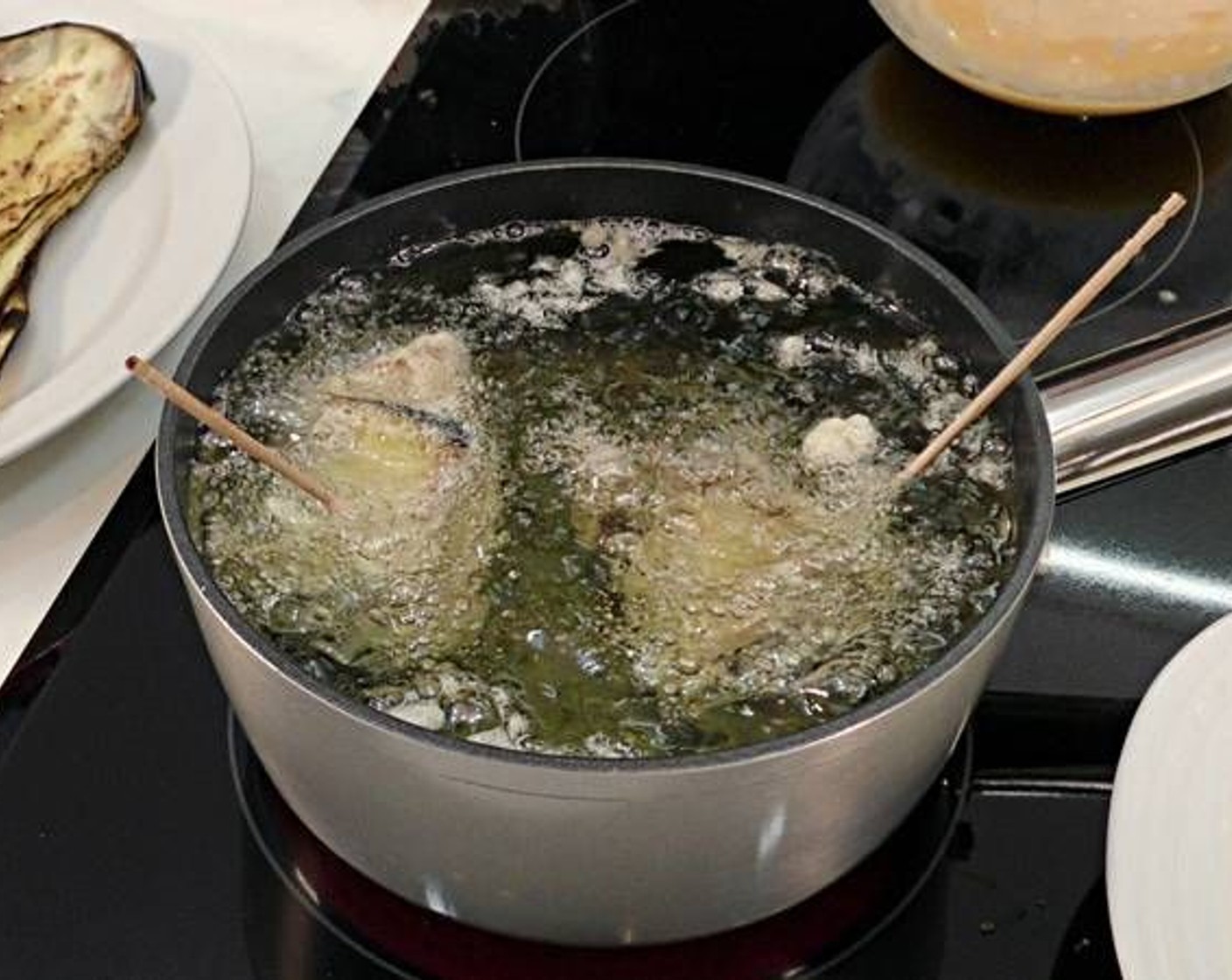 step 5 Roll the slices tightly and use wooden skewers to hold together. Dip and cover in All-Purpose Flour (to taste) and then dip and cover in Eggland's Best Classic Eggs (to taste). Then, in a large pot filled with hot oil, deep fry the stuffed rolls.