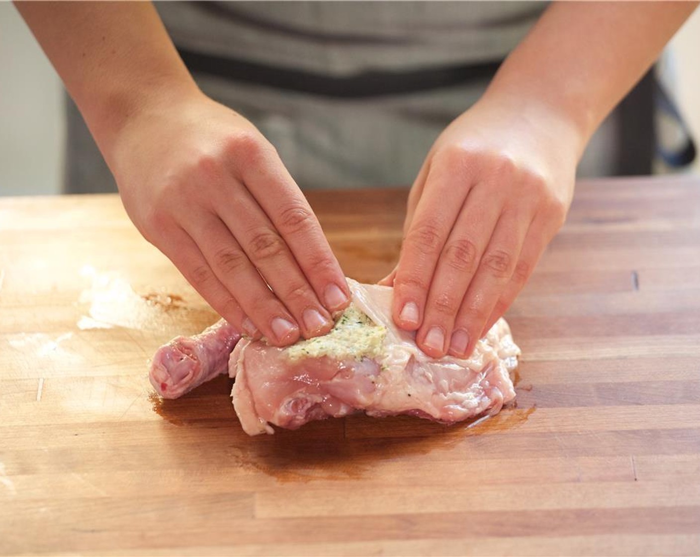 step 10 Lift up the skin of the chicken and rub two teaspoons of the herb butter underneath the skin of the chicken.