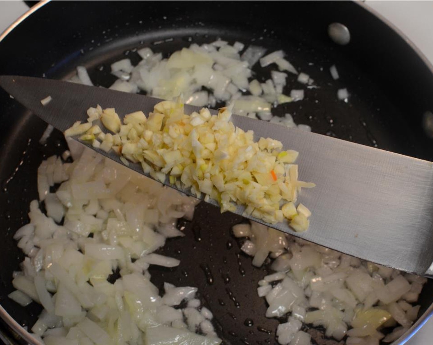 step 3 Add the Garlic (3 cloves) and sautee it with the onions for a couple minutes.