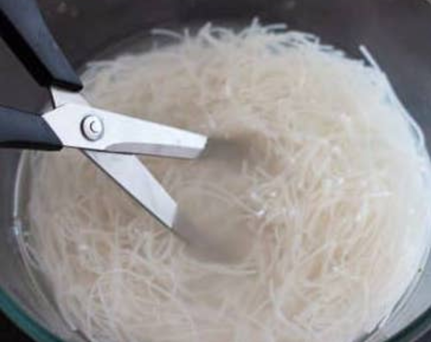 step 2 Once the vermicelli noodles are soft give them a few cuts so they’re shorter and easier to mix with the salad later.