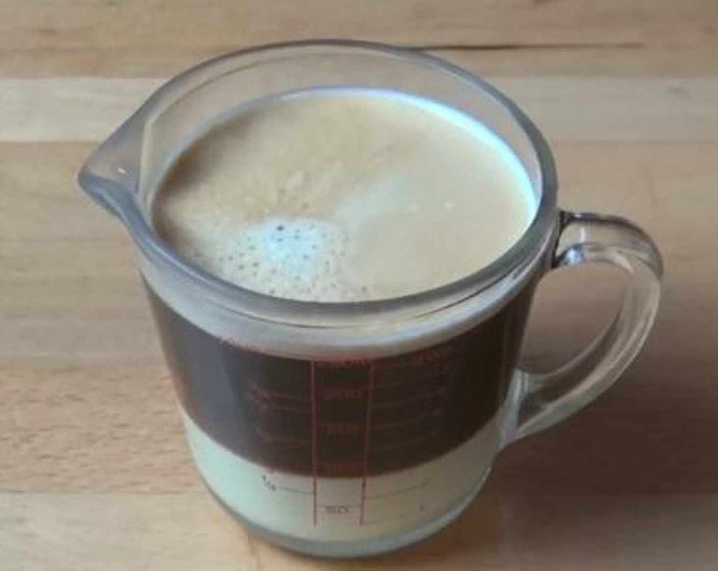 step 1 Into a cup, mix the La Lechera® Sweetened Condensed Milk (1/4 cup) and Coffee (3/4 cup) together.