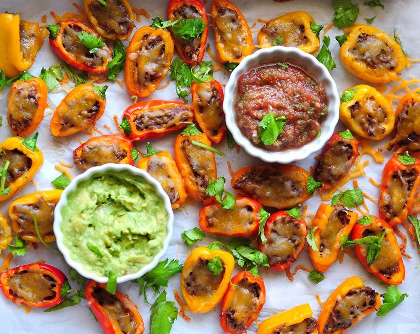 step 6 To serve, grab one mini stuffed pepper and dip it into Guacamole (to taste) or salsa, or both! Enjoy!