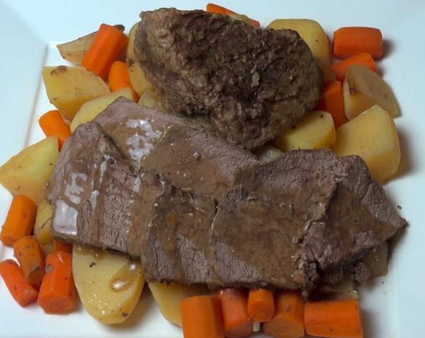 step 6 Arrange the roast over the vegetables on a serving platter and top with gravy.