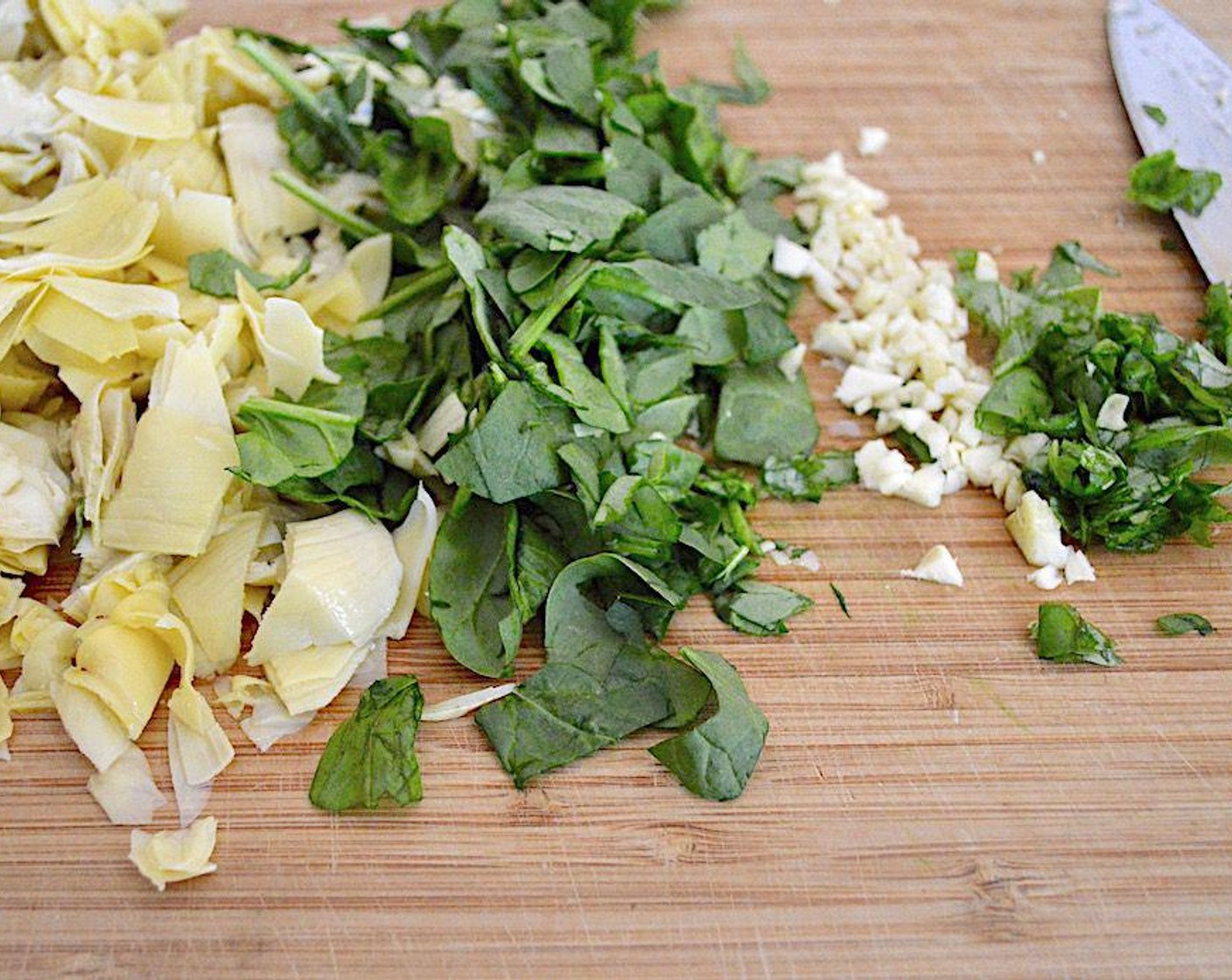 step 3 Heat the Olive Oil (1 dash) in a large skillet. Add the Artichoke (1 can),Fresh Baby Spinach (1 cup), Garlic (3 cloves), and Fresh Basil (1 Tbsp) and let them get fragrant for a couple of minutes.